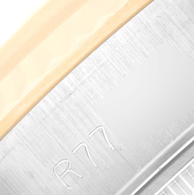 This image shows a macro shot of the serial number on the case back of a Rolex Datejust 69173 Women's Steel and Gold (two tone) Champagne Dial 69173 Women's Steel and Gold (two tone) Champagne Dial watch.