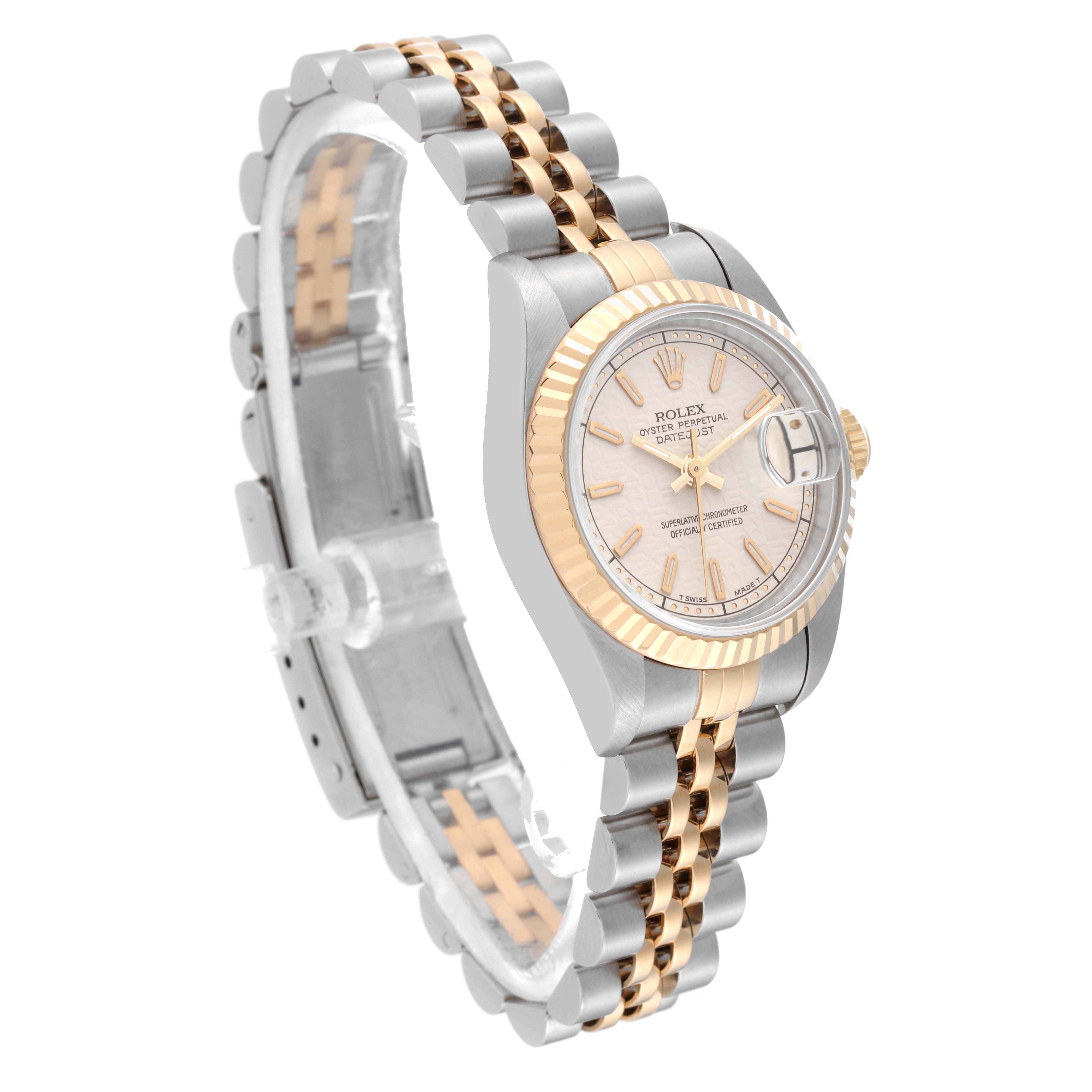 The Rolex Datejust 69173 Women's Steel and Gold (two tone) White Dial 69173 Women's Steel and Gold (two tone) White Dial watch is shown at an angle featuring the face, bezel, and partially open bracelet in two-tone metal.