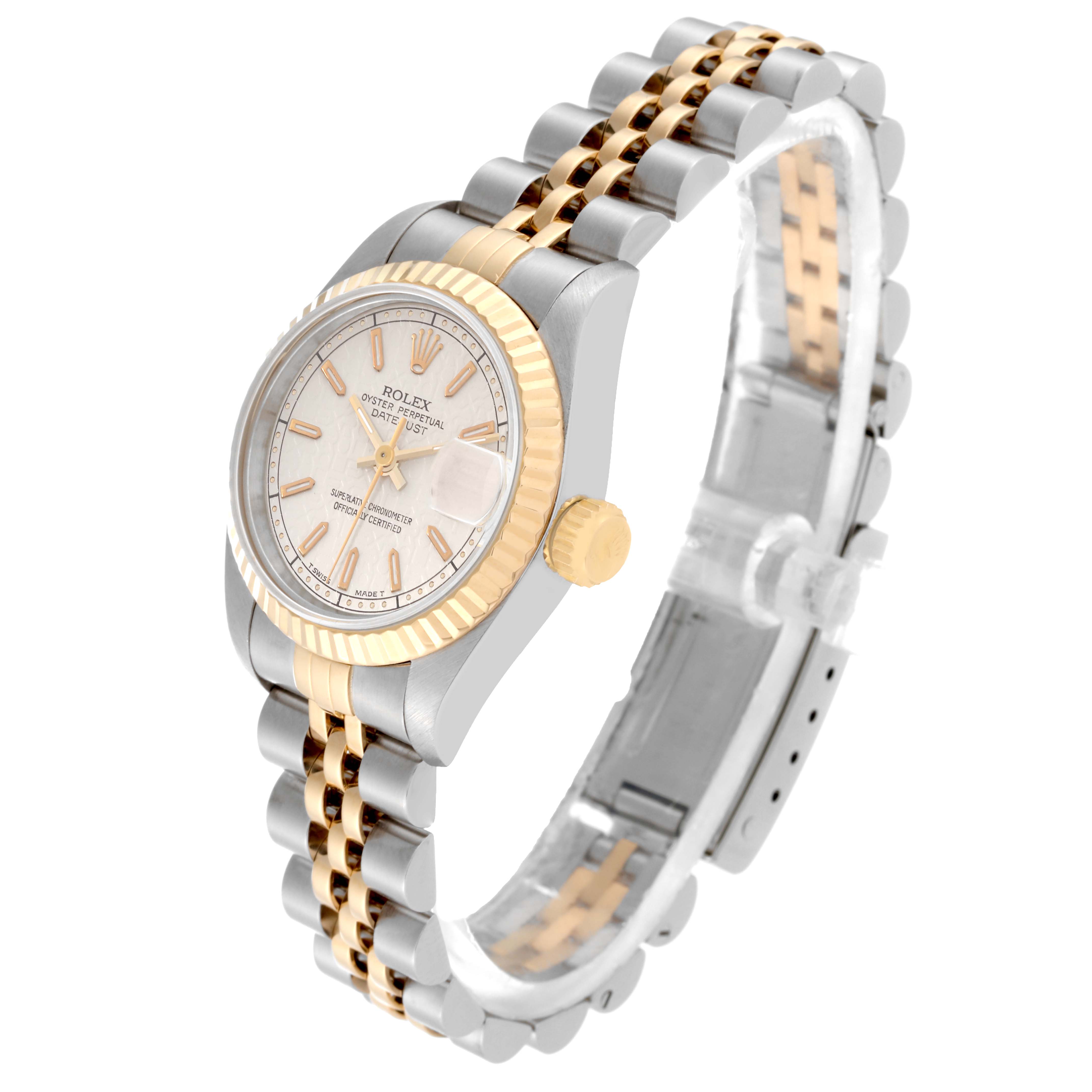 This image shows a Rolex Datejust 69173 Women's Steel and Gold (two tone) White Dial 69173 Women's Steel and Gold (two tone) White Dial watch at a tilted angle, highlighting its gold fluted bezel, crown, and two-tone bracelet.