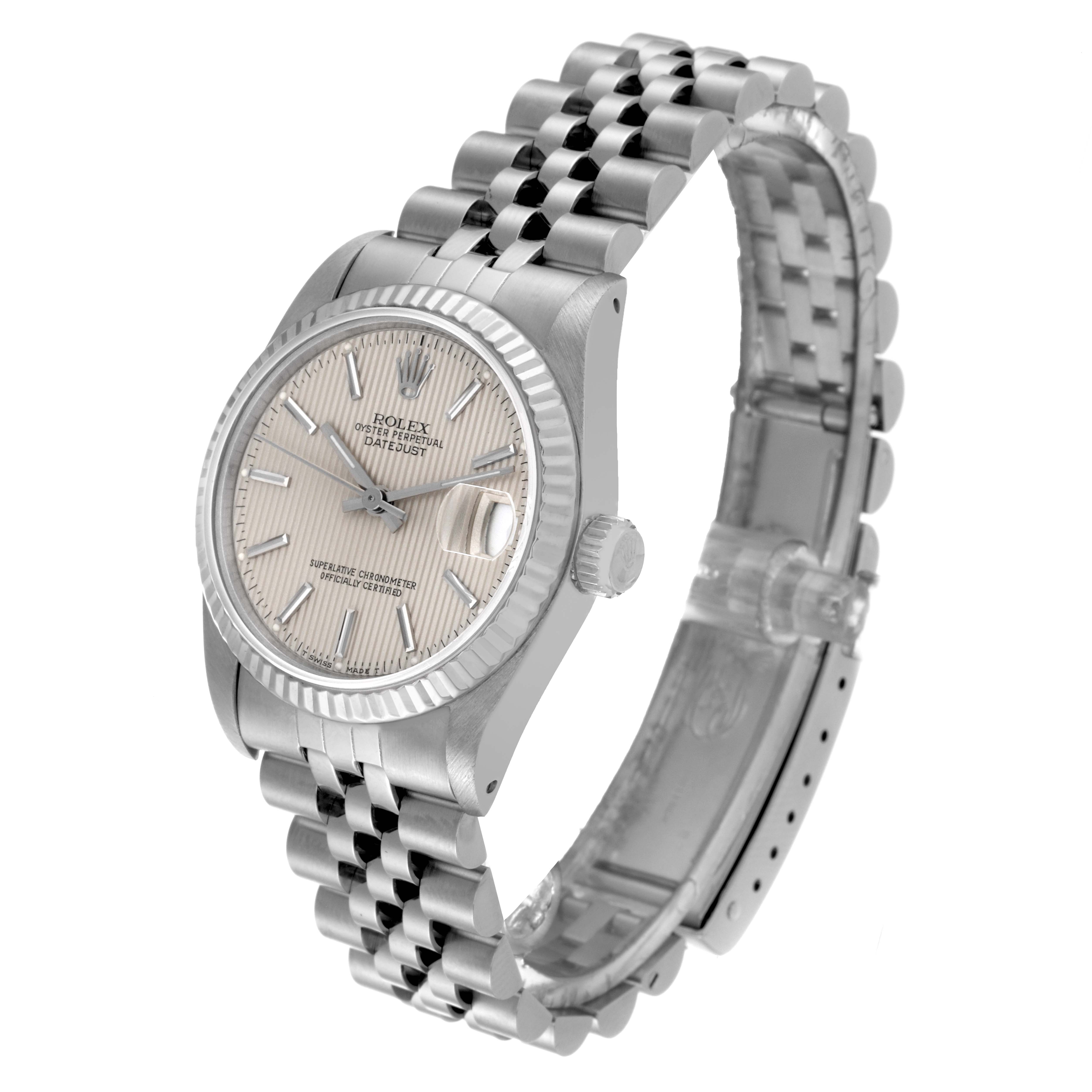 This image shows a side angle of a Mid-Size Rolex watch, displaying the watch face, case, crown, and stainless steel bracelet.