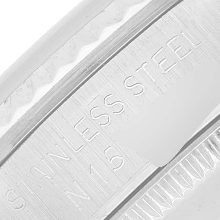 The image shows a close-up of the Rolex Mid-Size 68274 Women
s Stainless Steel Silver Dial 68274 Women
s Stainless Steel Silver Dial watch, focusing on the stainless steel bezel and engravings.