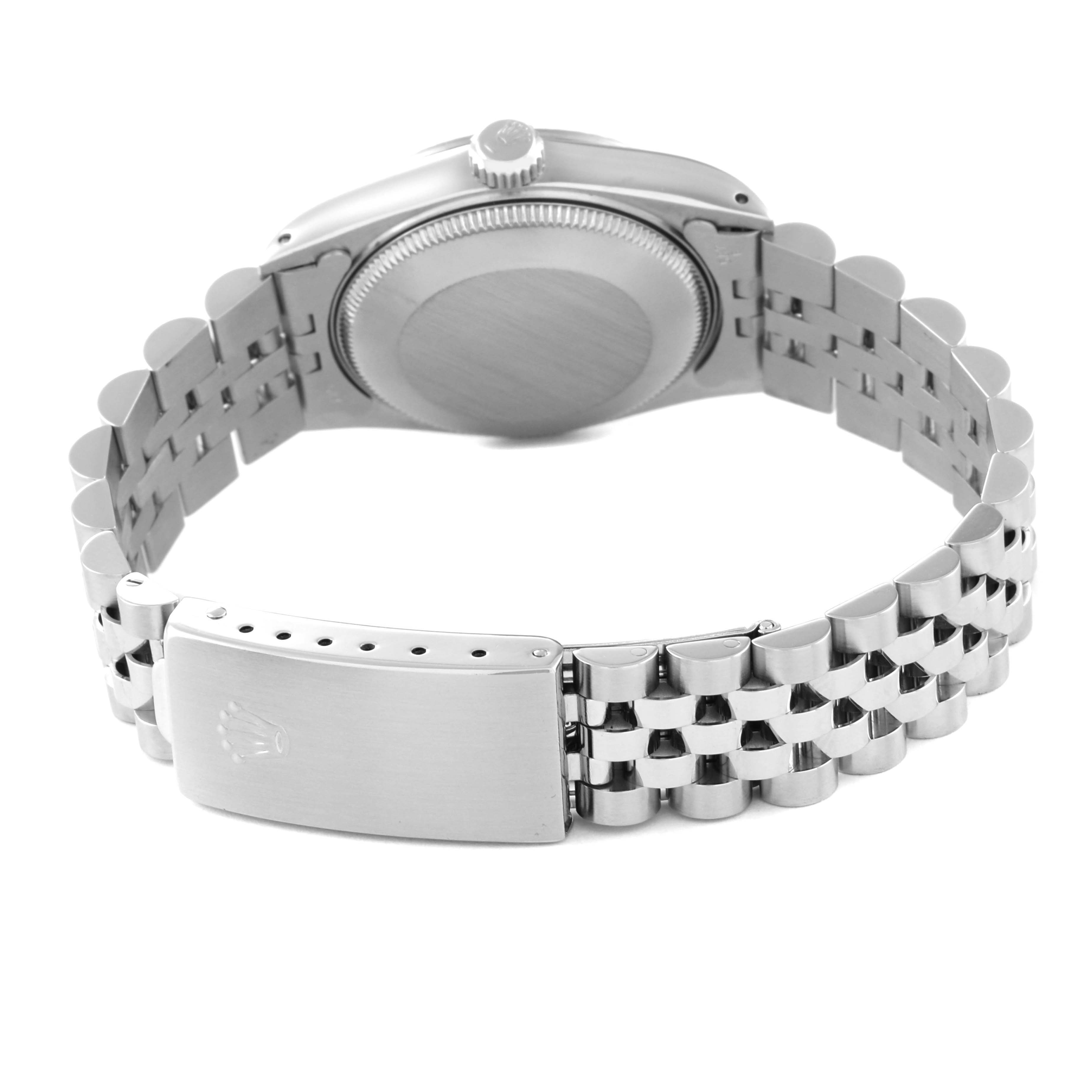 This image shows the back view and bracelet of a Mid-Size Rolex watch, including its clasp and case back.