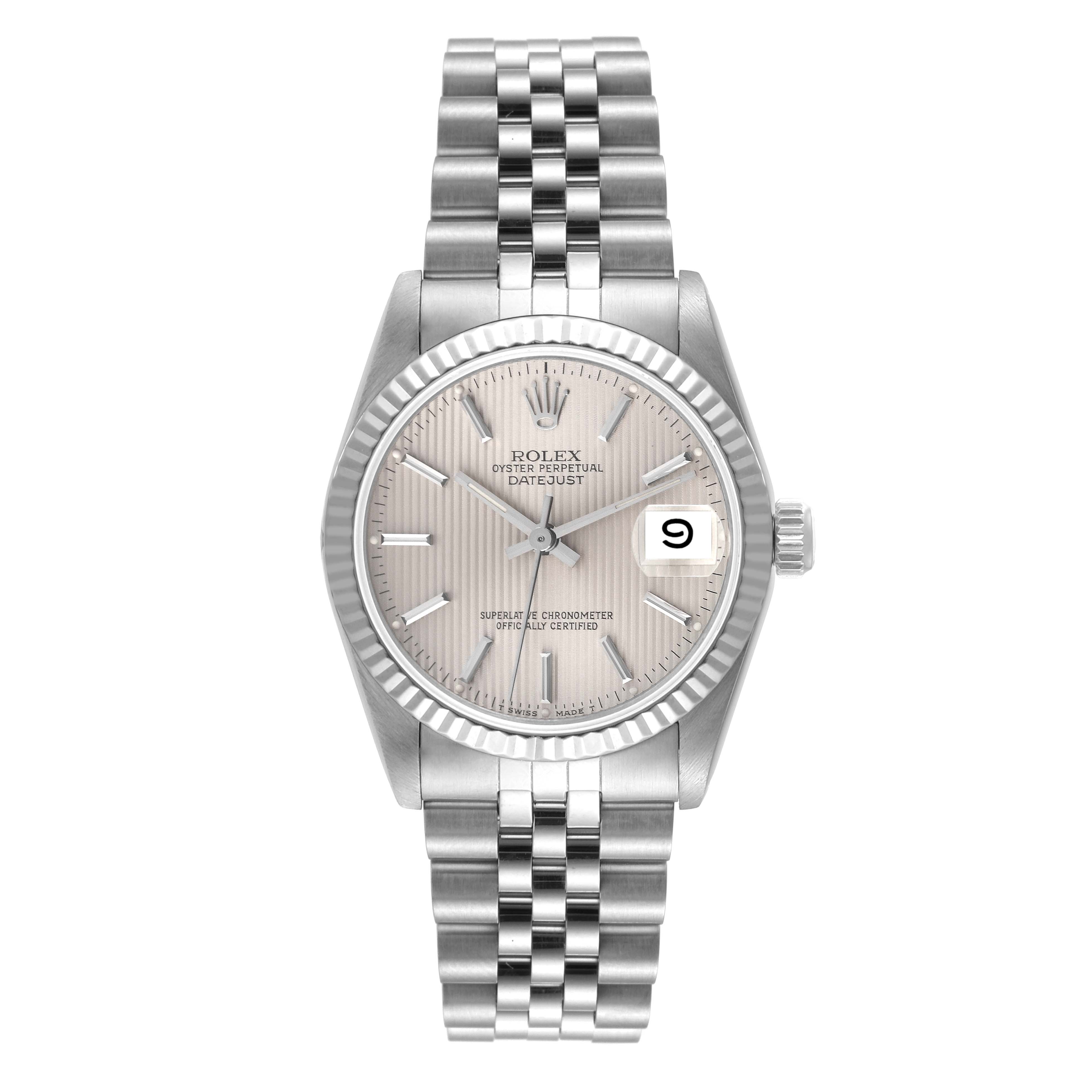 The Rolex Mid-Size 68274 Women
s Stainless Steel Silver Dial 68274 Women
s Stainless Steel Silver Dial Datejust watch is shown from a front angle, displaying its dial, bezel, and bracelet.
