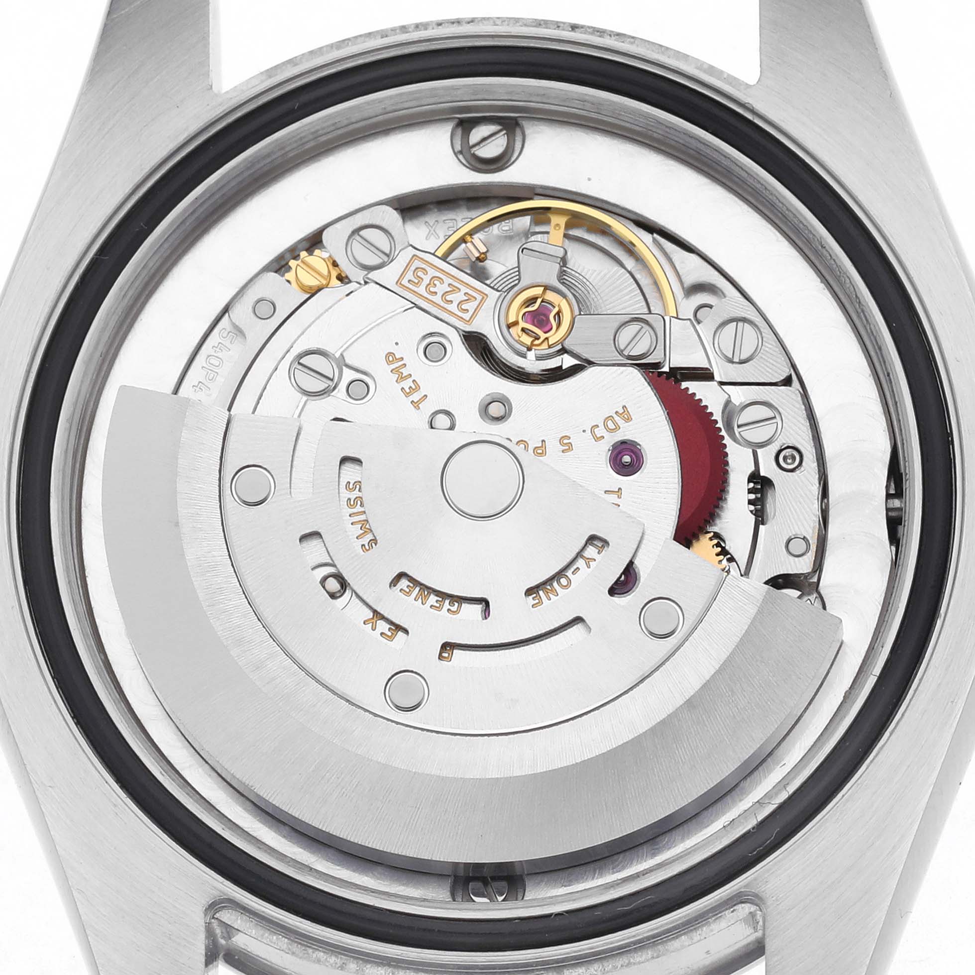The image shows the movement of a Rolex Mid-Size 178240 Women
s Stainless Steel Silver Dial 178240 Women
s Stainless Steel Silver Dial watch viewed from the back, highlighting the rotor and gears.