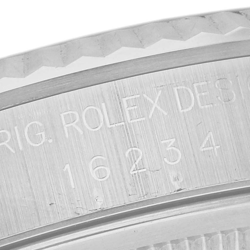 This image shows a close-up of the edge and casing engravings of a Rolex Datejust 16234 Men's Stainless Steel Silver Dial 16234 Men's Stainless Steel Silver Dial watch.