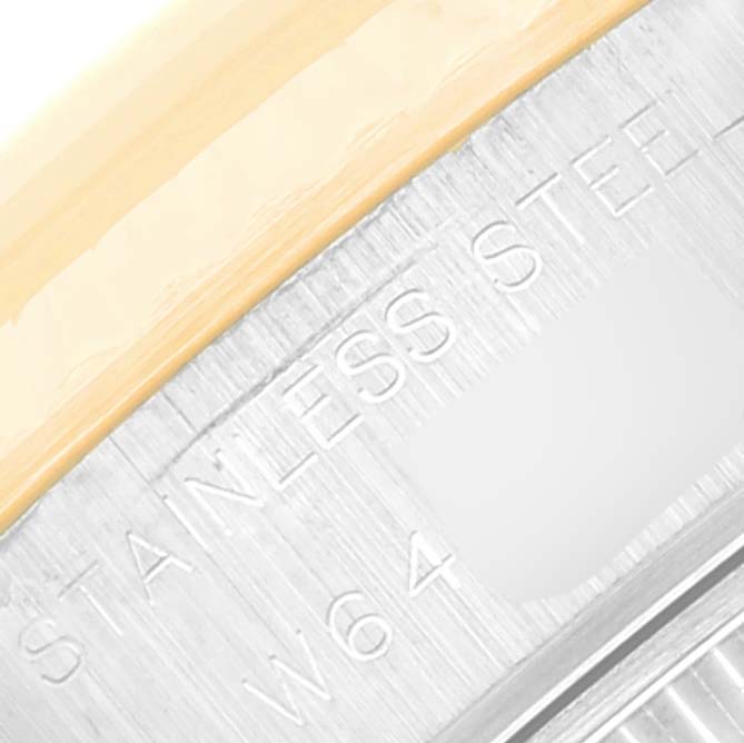 This image shows a close-up of the side of a stainless steel Rolex Datejust 69173 Women's Steel and Gold (two tone) Grey Dial 69173 Women's Steel and Gold (two tone) Grey Dial watch case with engraved text.