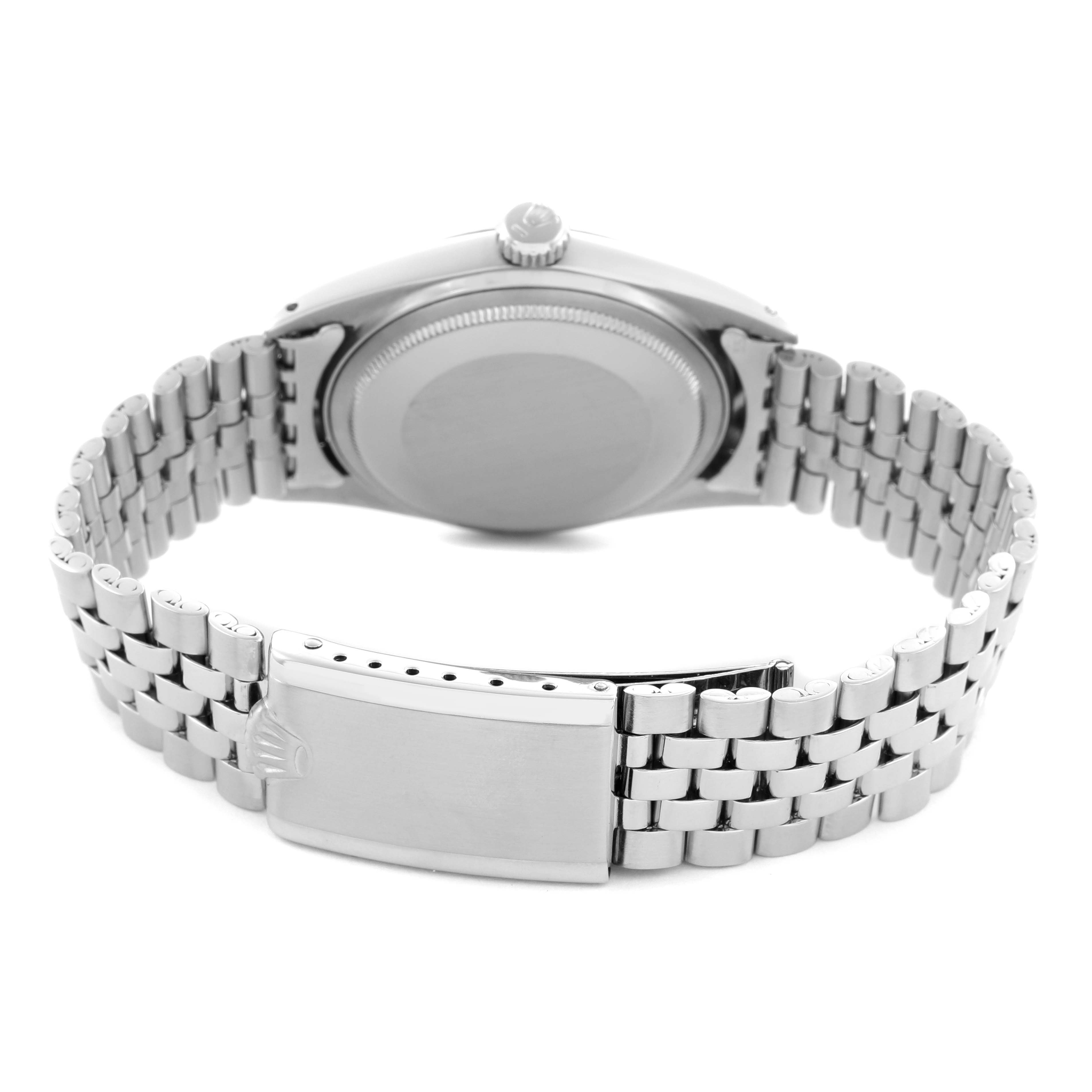 The image shows the back view of a Rolex Datejust 1601 Men
s Stainless Steel Blue Dial 1601 Men
s Stainless Steel Blue Dial watch, highlighting its case back, crown, and bracelet with the clasp.