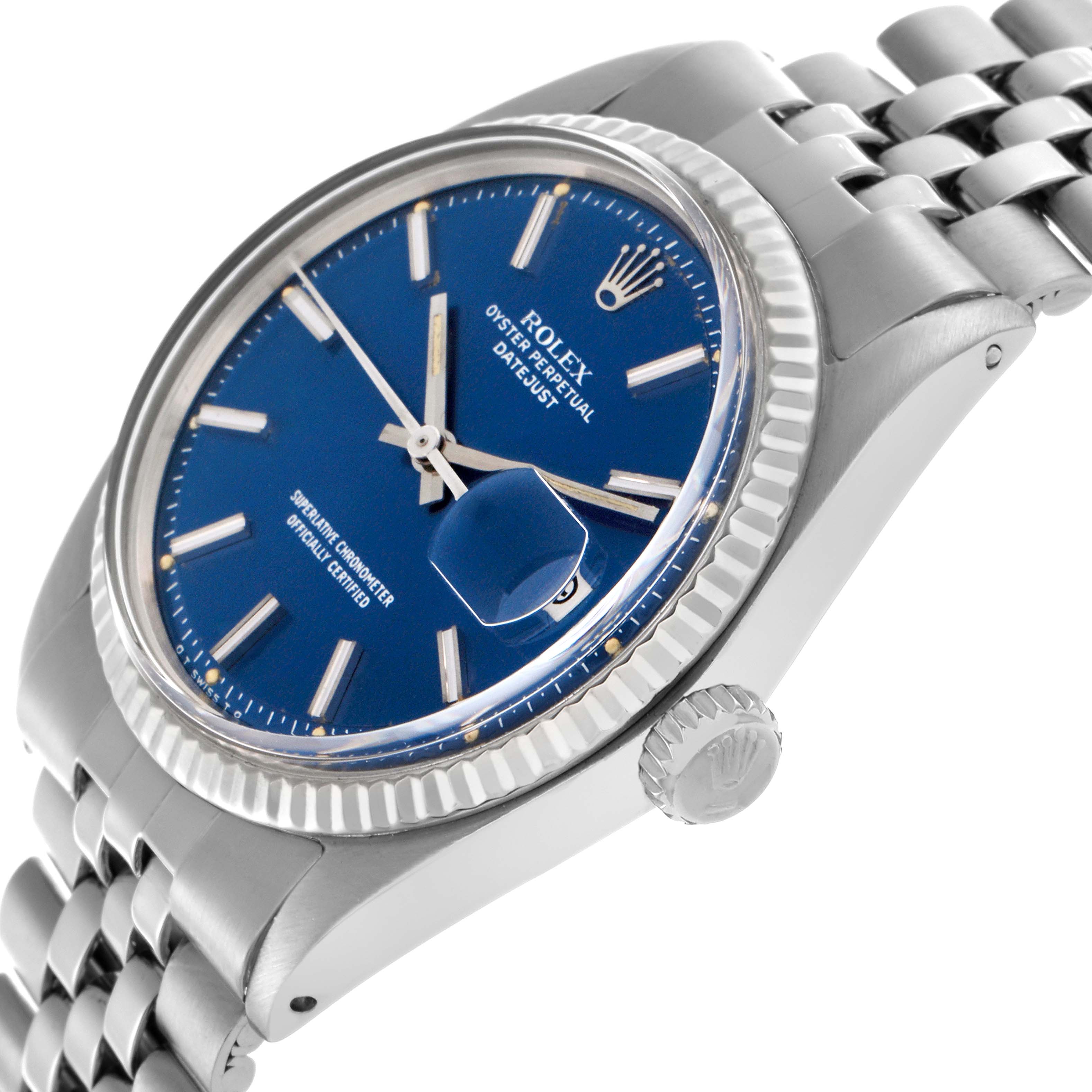 The Rolex Datejust 1601 Men
s Stainless Steel Blue Dial 1601 Men
s Stainless Steel Blue Dial watch is shown at an angled side view, highlighting the blue dial, fluted bezel, Cyclops lens, and Jubilee bracelet.