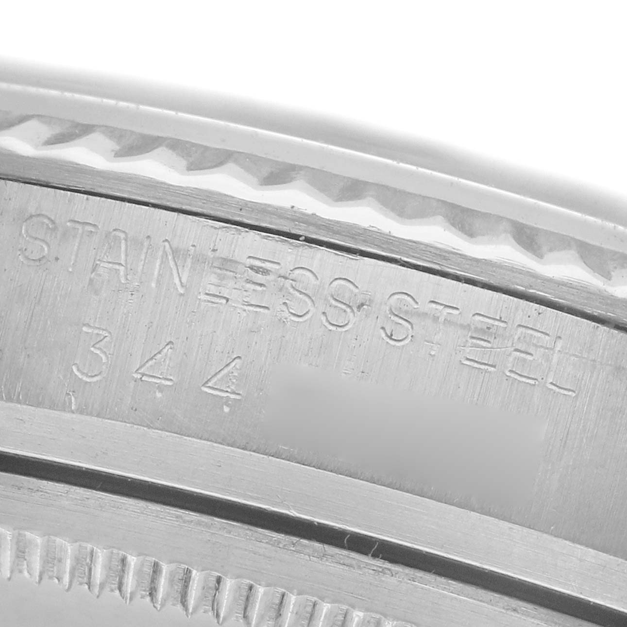 The image shows a close-up of the stainless steel engravings on the side of a Rolex Datejust 1601 Men
s Stainless Steel Blue Dial 1601 Men
s Stainless Steel Blue Dial watch.