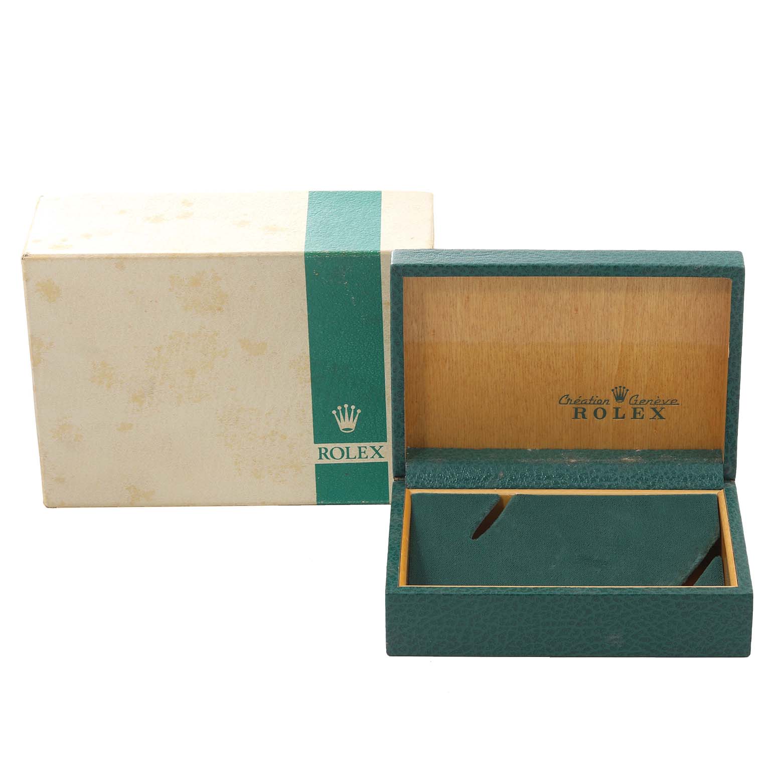 This image shows the open packaging box of a Vintage Collection Rolex watch, displaying its green and wooden interior.