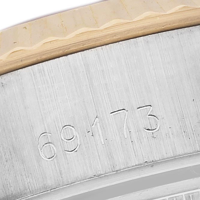 The image shows a close-up of the engraved case side of a Rolex Datejust 69173 Women
s Steel and Gold (two tone) Champagne Dial 69173 Women
s Steel and Gold (two tone) Champagne Dial, displaying the model number.