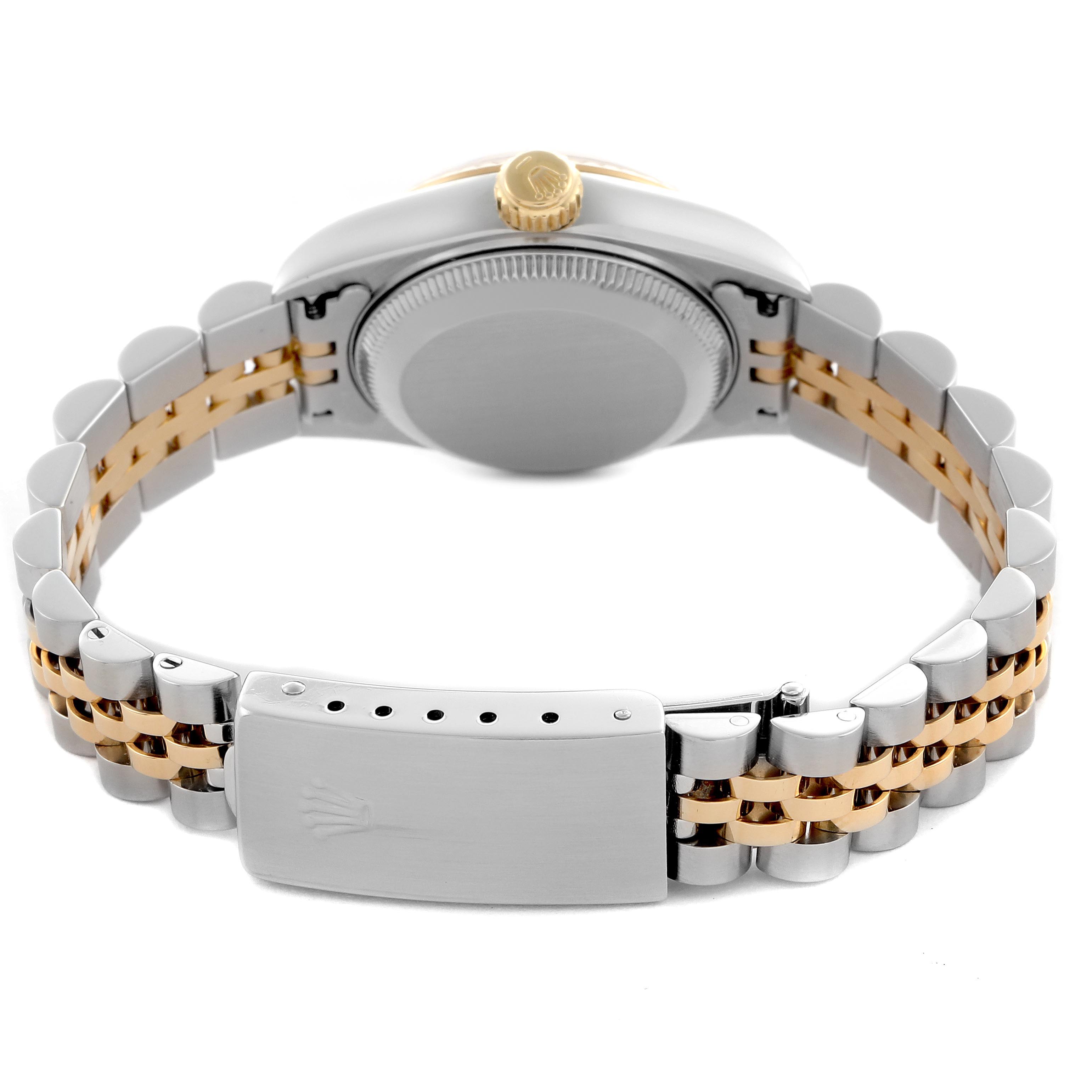 The image shows the back of a Rolex Datejust 69173 Women
s Steel and Gold (two tone) Champagne Dial 69173 Women
s Steel and Gold (two tone) Champagne Dial, highlighting the bracelet and clasp in a two-tone design.