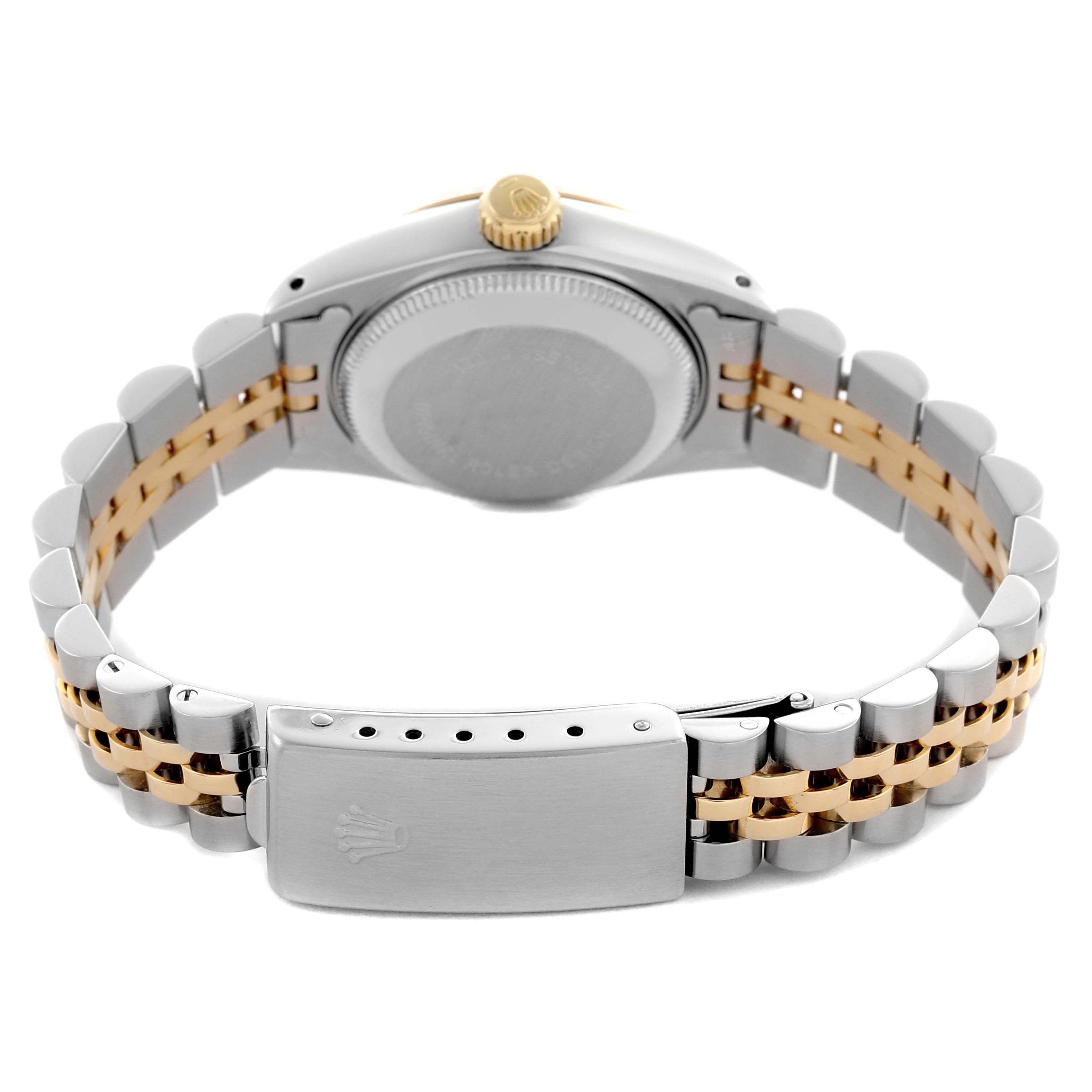 The Rolex Datejust 69173 Women
s Steel and Gold (two tone) Champagne Dial 69173 Women
s Steel and Gold (two tone) Champagne Dial watch is shown from the back, displaying the case back, crown, and two-tone bracelet with clasp.