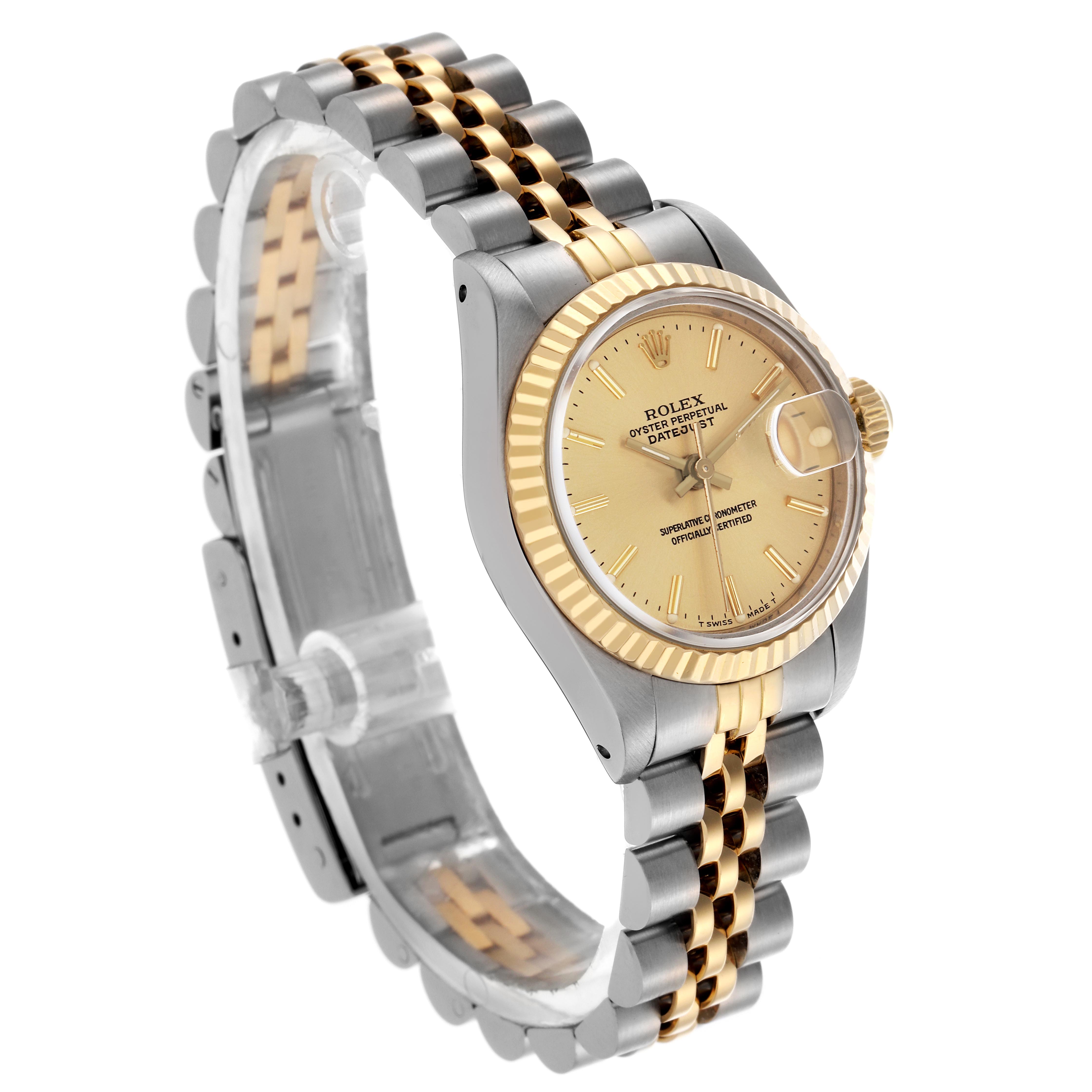 The Rolex Datejust 69173 Women
s Steel and Gold (two tone) Champagne Dial 69173 Women
s Steel and Gold (two tone) Champagne Dial watch is shown at a tilted angle, highlighting the gold and silver jubilee bracelet and fluted bezel.