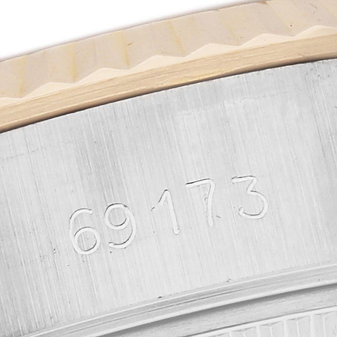 The image shows a close-up of the case side and bezel of a Rolex Datejust 69173 Women
s Steel and Gold (two tone) Champagne Dial 69173 Women
s Steel and Gold (two tone) Champagne Dial, highlighting the engraved reference number.