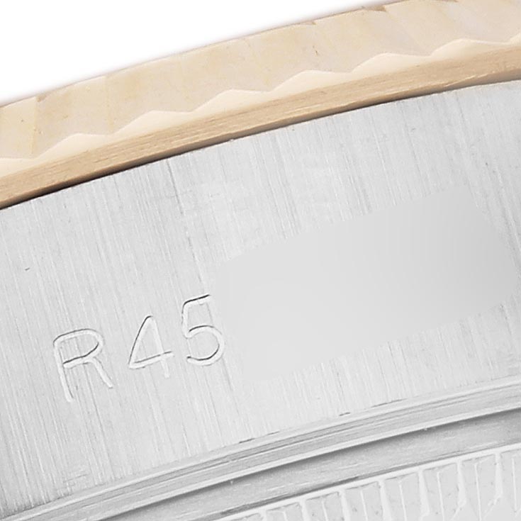 The image shows a close-up of the case edge and bezel detail of the Rolex Datejust 69173 Women
s Steel and Gold (two tone) Champagne Dial 69173 Women
s Steel and Gold (two tone) Champagne Dial watch.