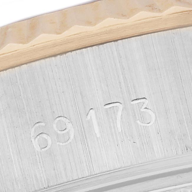 The image shows a close-up of the side of a Rolex Datejust 69173 Women's Steel and Gold (two tone) Champagne Dial 69173 Women's Steel and Gold (two tone) Champagne Dial, highlighting the model number engraved on the side.