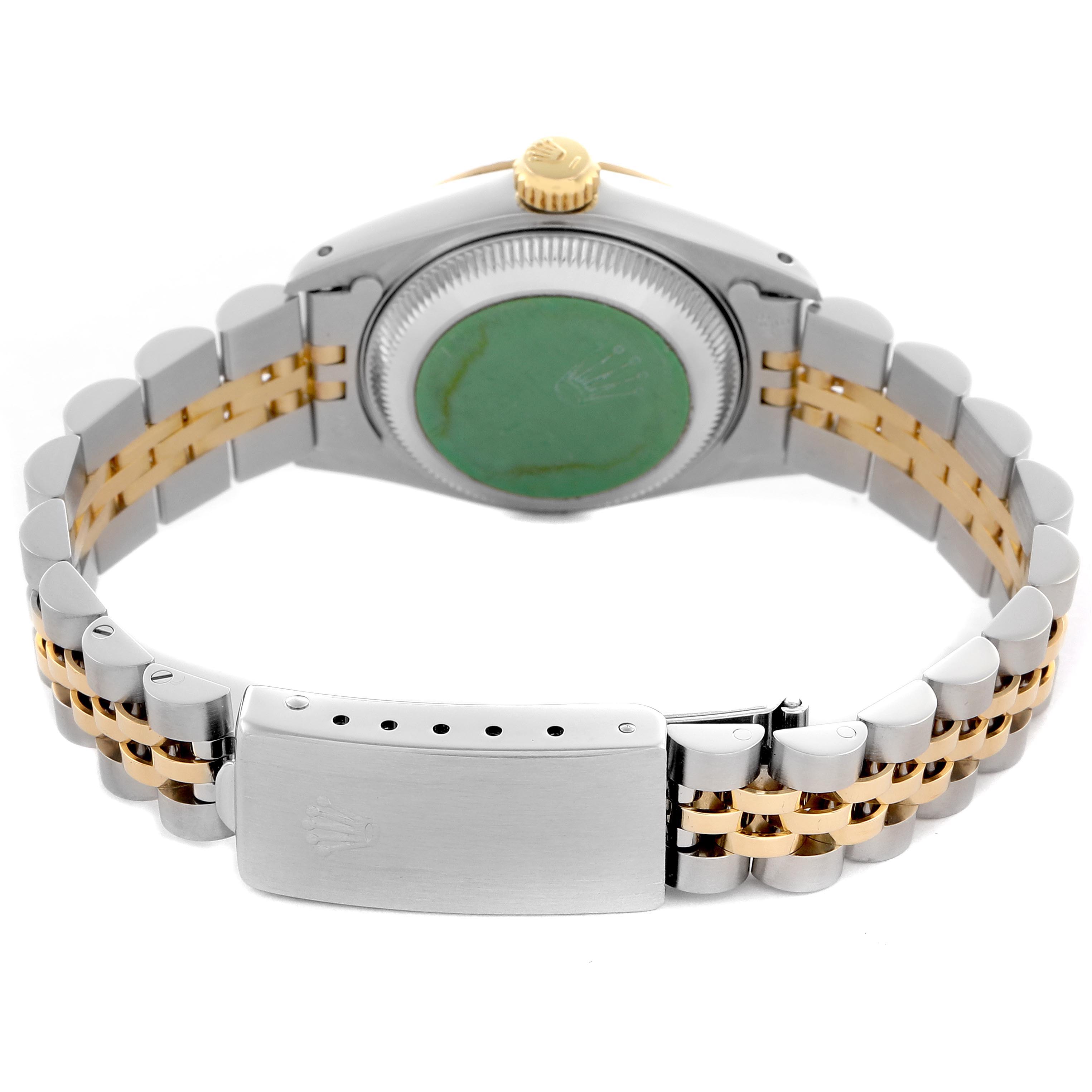 The image shows the back and bracelet of a Rolex Datejust 69173 Women
s Steel and Gold (two tone) Silver Dial 69173 Women
s Steel and Gold (two tone) Silver Dial, featuring a two-tone metal design and the clasp.