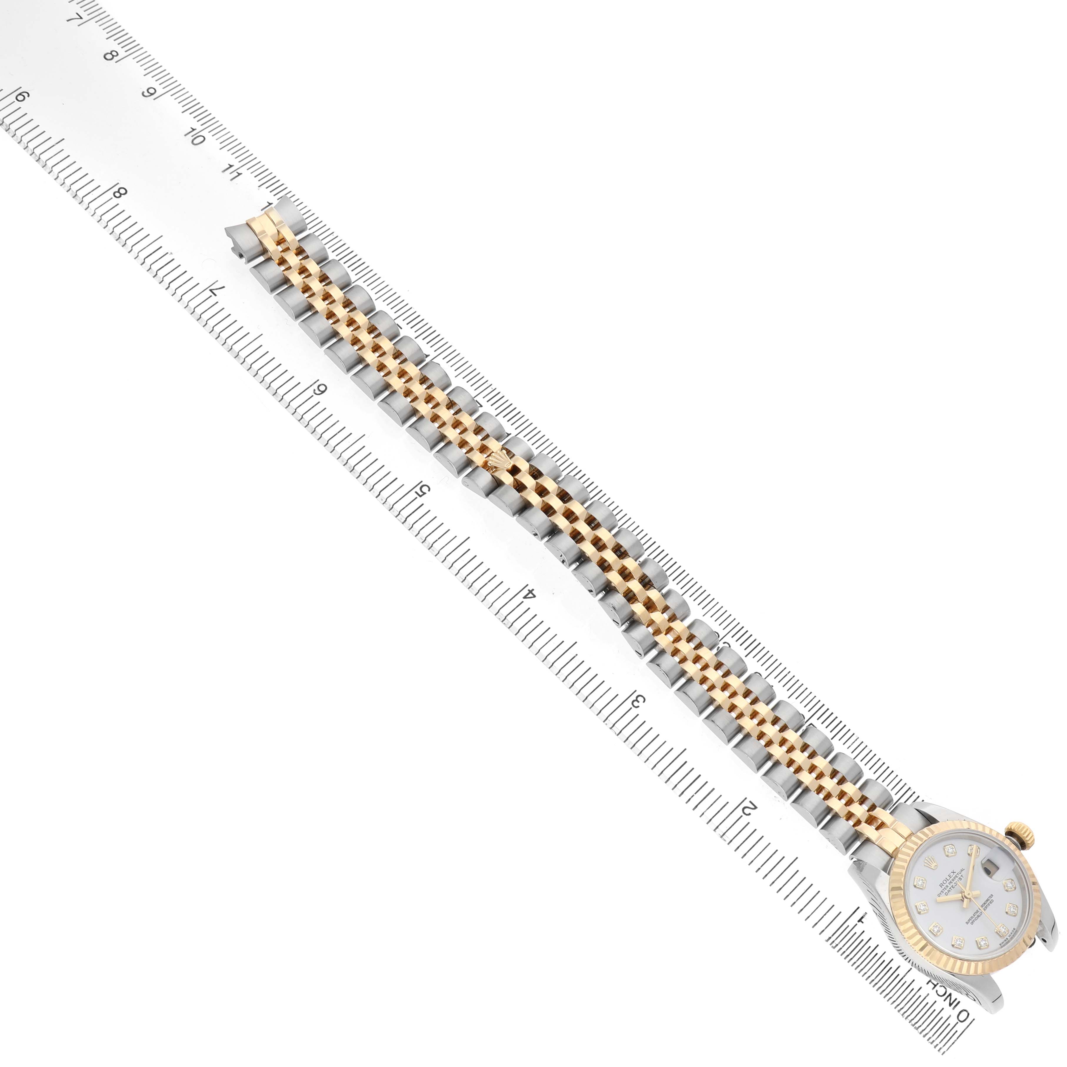 The Rolex Datejust 179173 Women's Steel and Gold (two tone) White Dial is shown from a top-down angle, displaying the full bracelet and a partial view of the watch face.