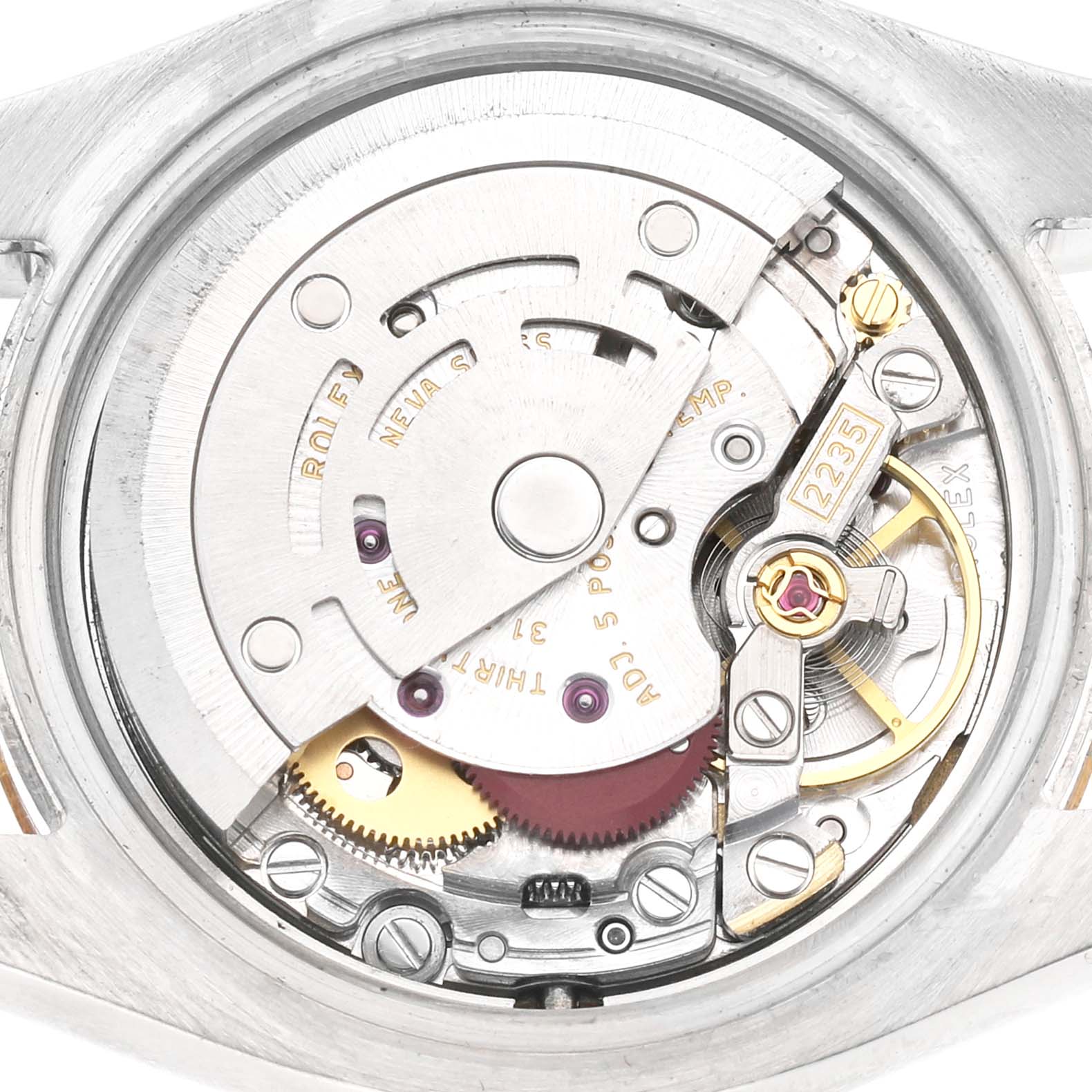 This image shows a detailed view of the Rolex Datejust 179173 Women's Steel and Gold (two tone) White Dial watch movement, highlighting the inner mechanical components.