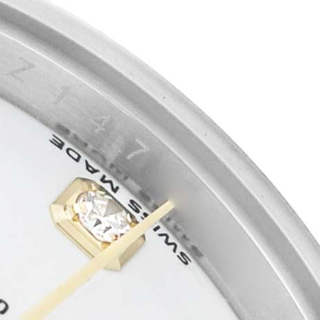The image shows a close-up of the Rolex Datejust 179173 Women's Steel and Gold (two tone) White Dial watch face, highlighting a diamond index, a portion of the bezel, and "Swiss Made."