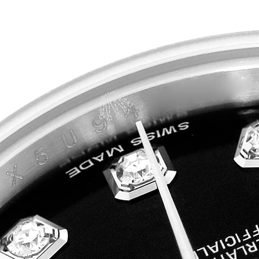 This image shows a close-up angle of a Rolex Datejust 179174 Women's Stainless Steel Black Dial 179174 Women's Stainless Steel Black Dial watch dial, featuring the "SWISS MADE" text and diamond hour markers.