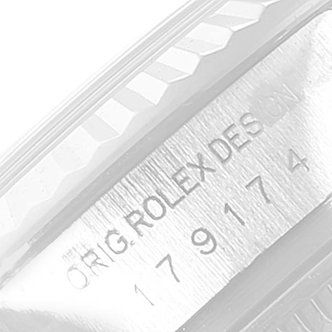 The image shows a close-up view of the serial number and the "ORIG. ROLEX DESIGN" engraving on the bezel of a Rolex Datejust 179174 Women's Stainless Steel Silver Dial 179174 Women's Stainless Steel Silver Dial watch.