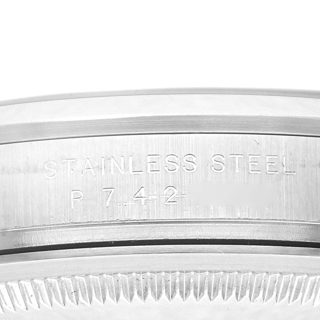 The image shows a close-up of the side of a stainless steel Rolex Explorer 114270 Men
s Stainless Steel Black Dial 114270 Men
s Stainless Steel Black Dial, highlighting the engraved text on its case.