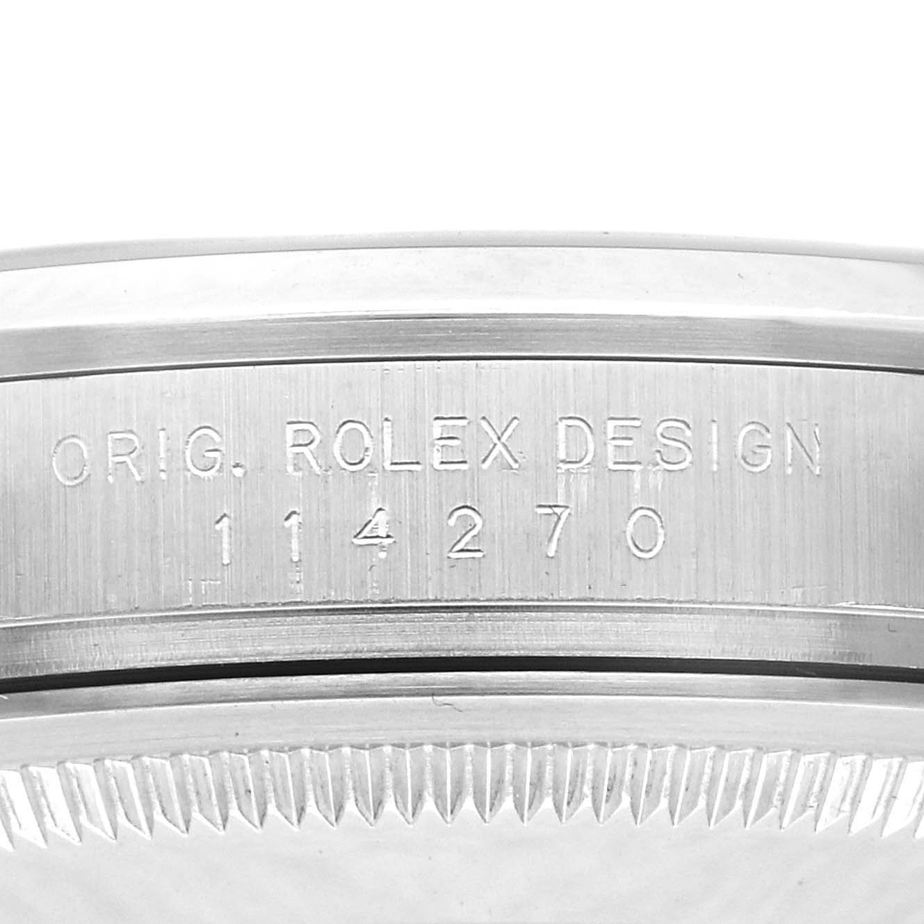 The image shows a close-up of the side of a Rolex Explorer 114270 Men
s Stainless Steel Black Dial 114270 Men
s Stainless Steel Black Dial with the model number engraved on the case.
