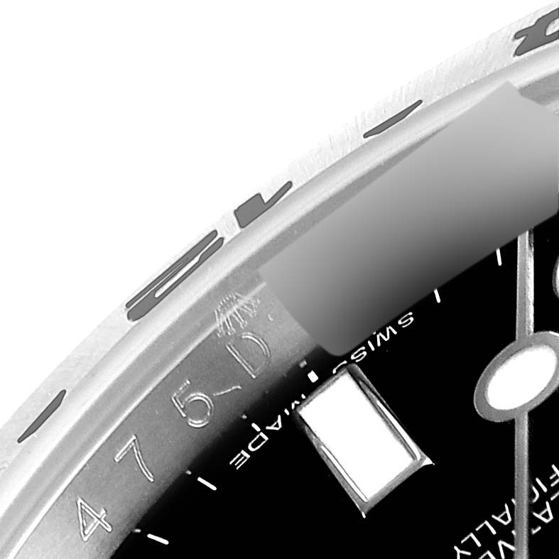 The image depicts a close-up of the dial and bezel of a Rolex Explorer 216570 Men's Stainless Steel Black Dial 216570 Men's Stainless Steel Black Dial watch.