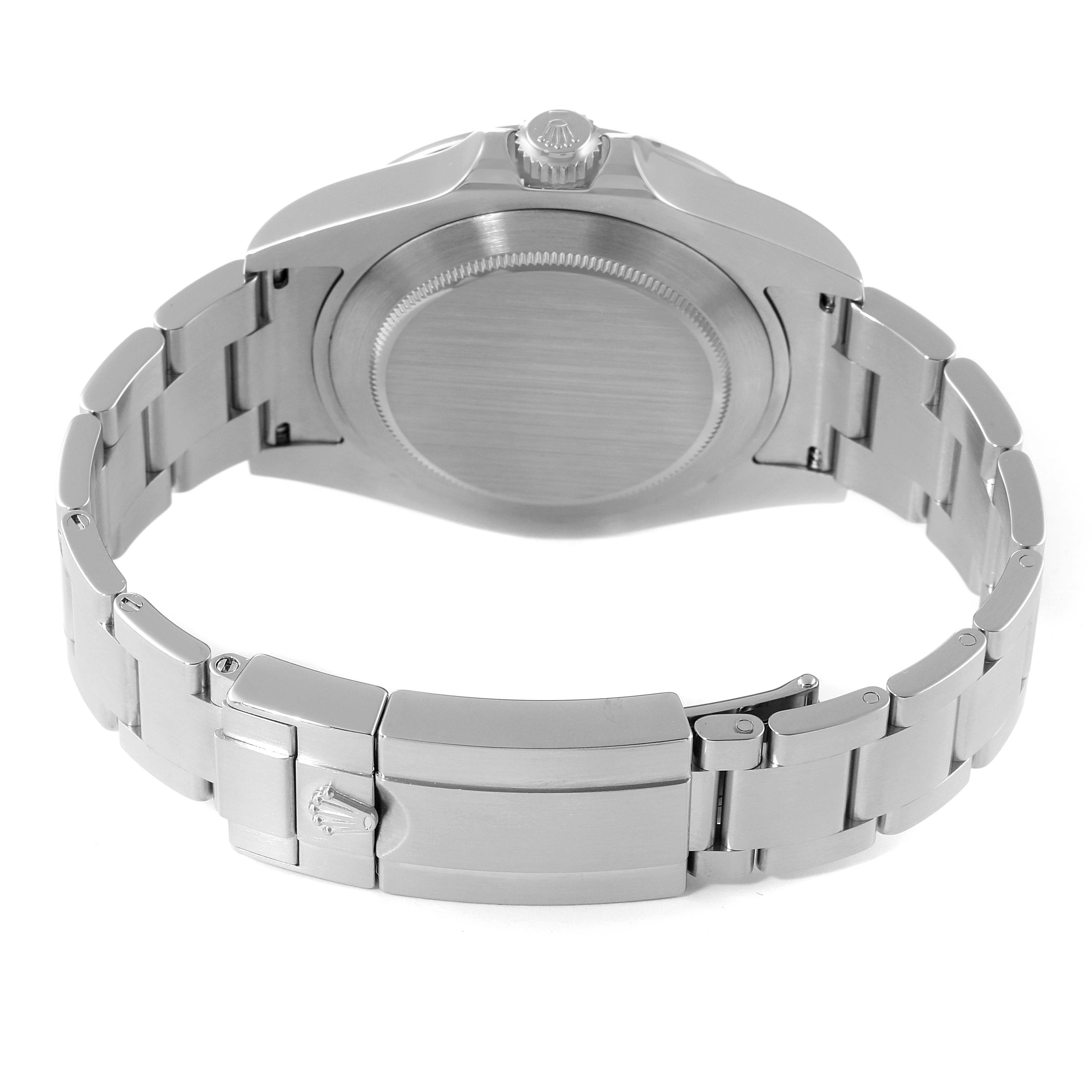 This image shows the back side of a Rolex Explorer 216570 Men's Stainless Steel Black Dial 216570 Men's Stainless Steel Black Dial watch, including its case back, crown, and bracelet with the clasp.