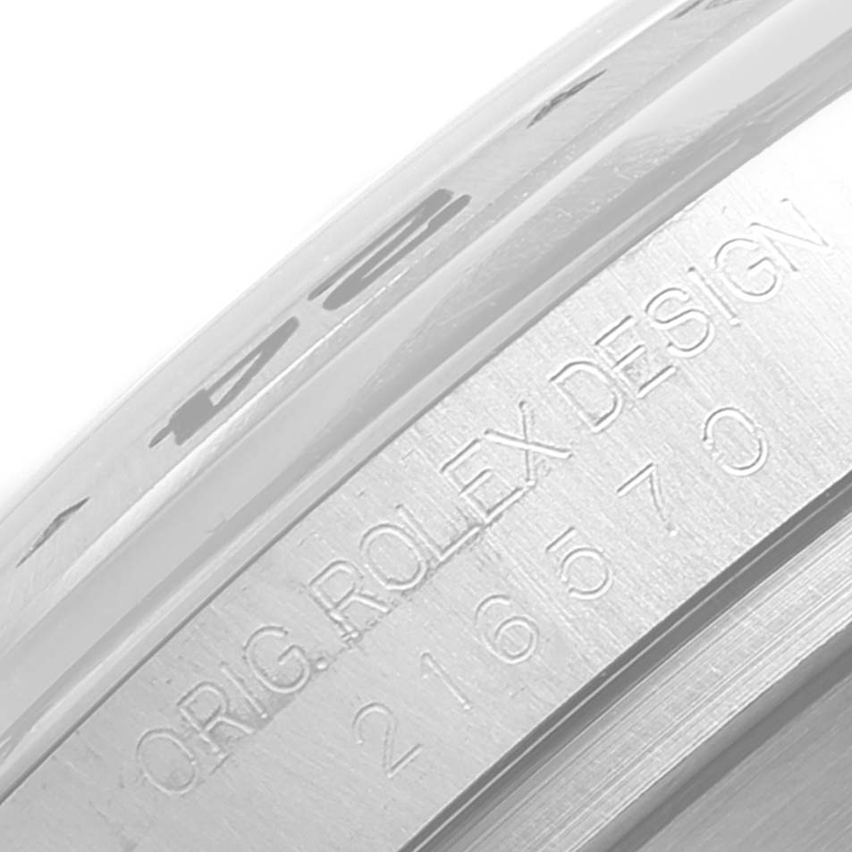 The image shows a close-up of the side engraving on the bezel of a Rolex Explorer 216570 Men's Stainless Steel Black Dial 216570 Men's Stainless Steel Black Dial watch.