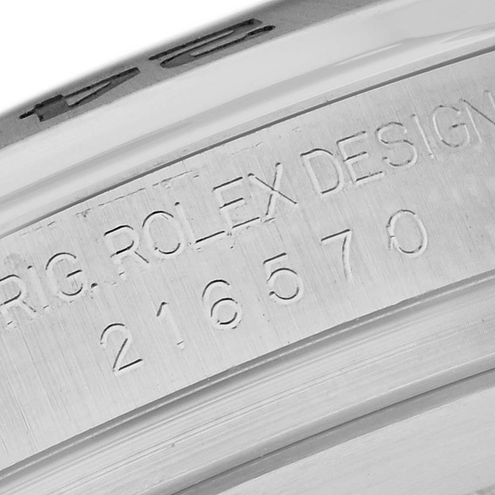 The image shows a close-up of the serial number engraving on the inner rim of a Rolex Explorer 216570 Men
s Stainless Steel Black Dial 216570 Men
s Stainless Steel Black Dial watch.