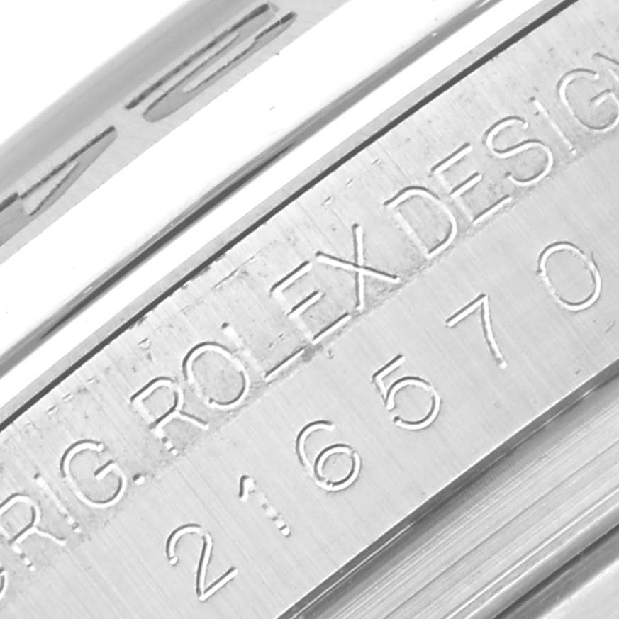 The image shows a close-up of the engraving on the side of the Rolex Explorer 216570 Men
s Stainless Steel Black Dial 216570 Men
s Stainless Steel Black Dial model.