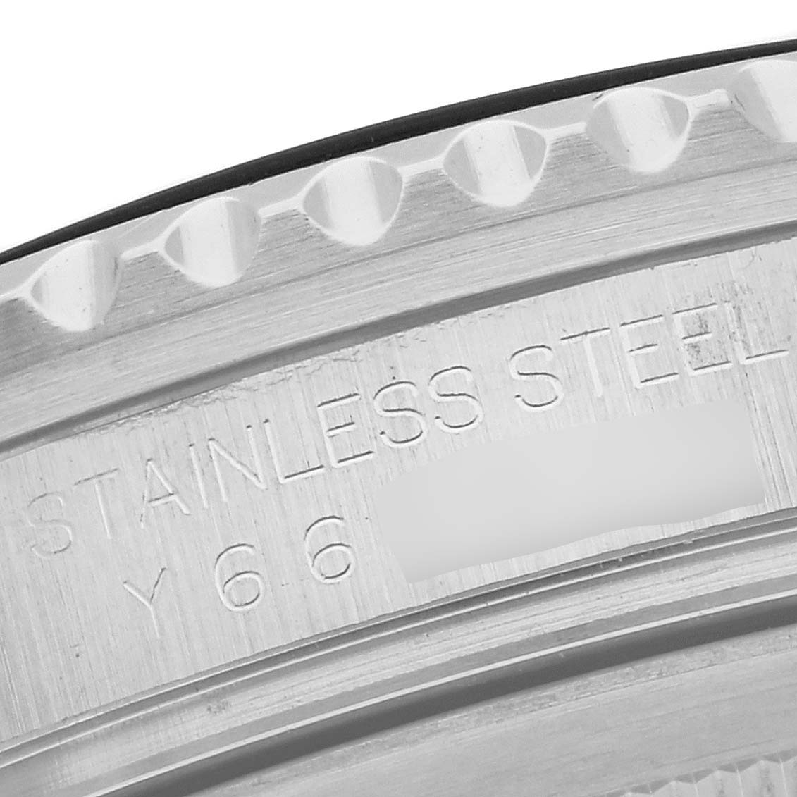 This close-up image shows the engraved text on the stainless steel casing of a Rolex GMT-Master 16710 Men's Stainless Steel Black Dial 16710 Men's Stainless Steel Black Dial watch.