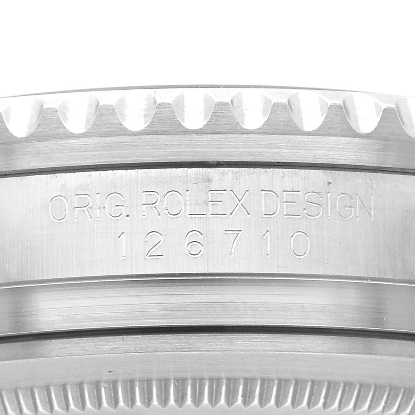 This image shows a close-up of the case side of the Rolex GMT-Master 126710BLNR Men's Stainless Steel Black Dial 126710BLNR Men's Stainless Steel Black Dial with model number 126710 engraved on it.