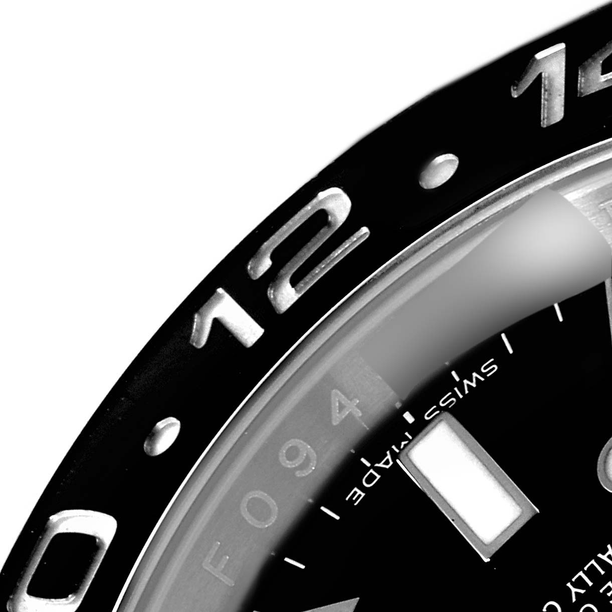 This close-up image shows the bezel and part of the dial of the Rolex GMT-Master 116710 Men's Stainless Steel Black Dial 116710 Men's Stainless Steel Black Dial watch.