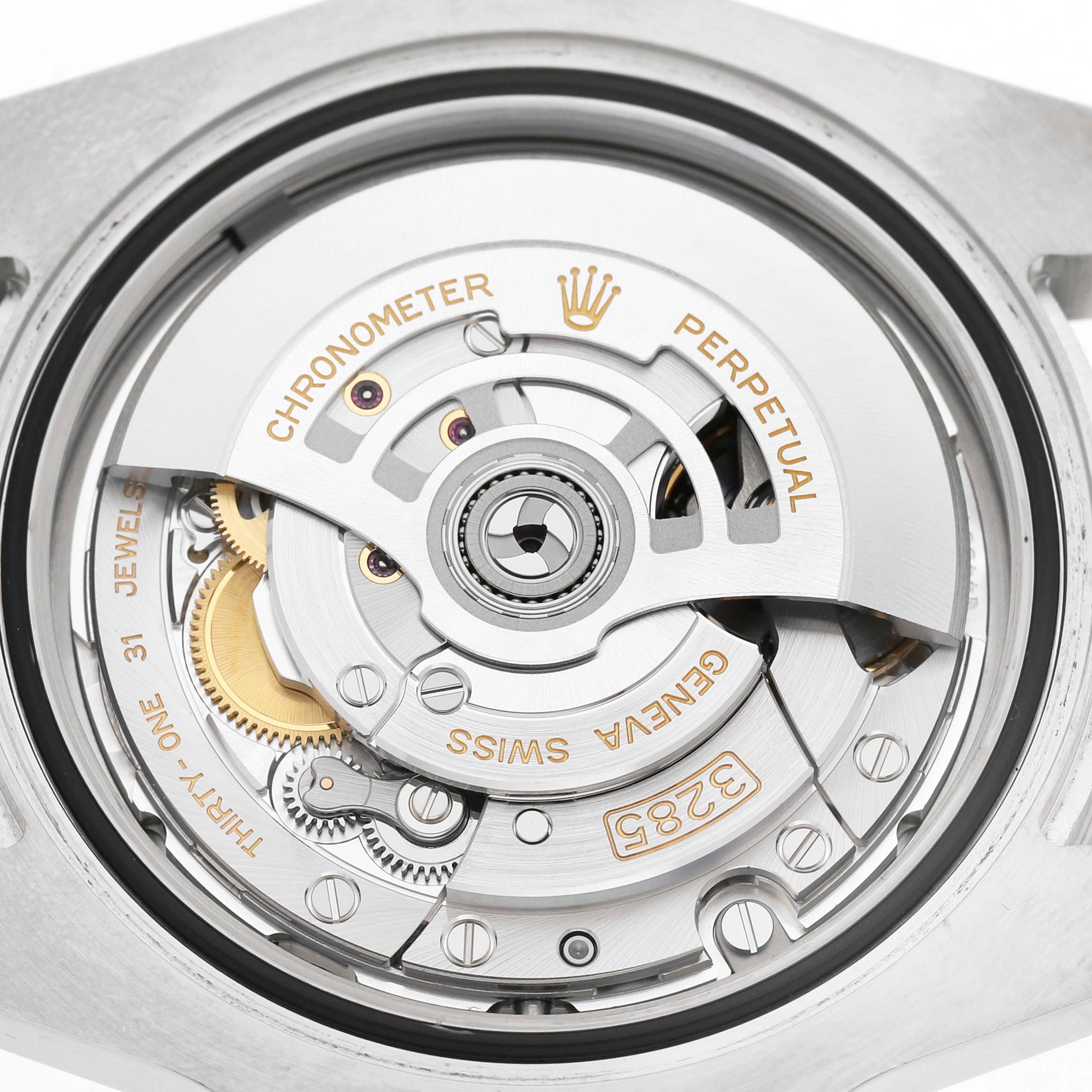 The image shows the movement mechanism of a Rolex GMT-Master 126710 Men's Stainless Steel Black Dial, focusing on the intricate gears and the rotor.
