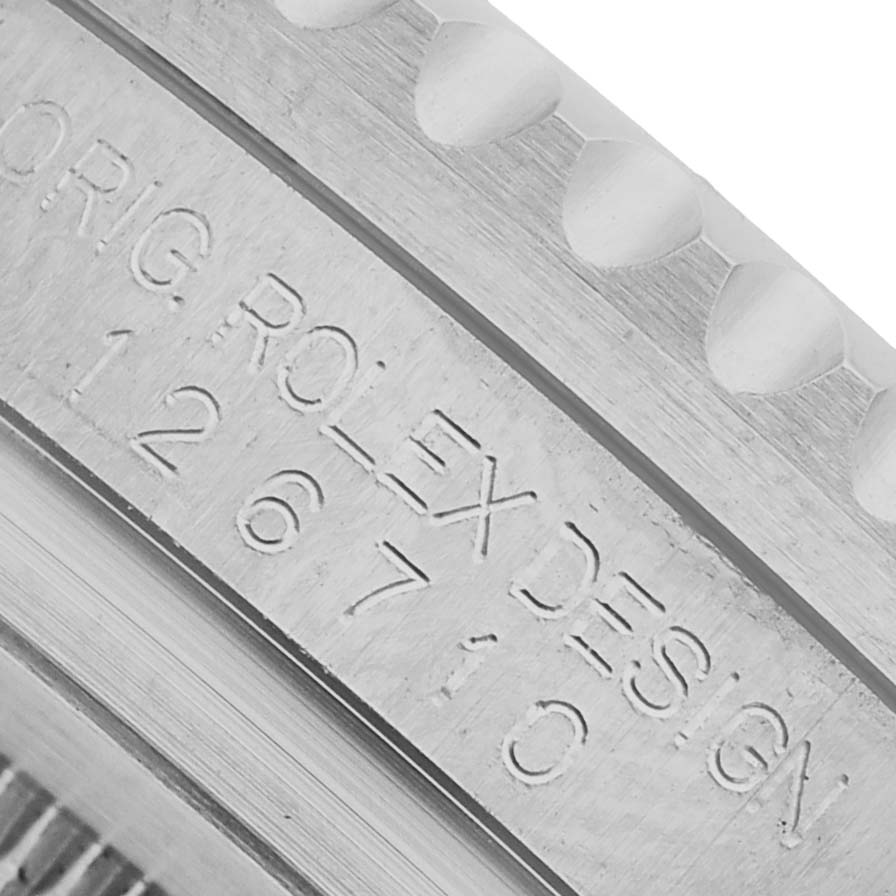The image shows a close-up of the side of the Rolex GMT-Master 126710 Men's Stainless Steel Black Dial model, highlighting the engraved serial number and part of the bezel.