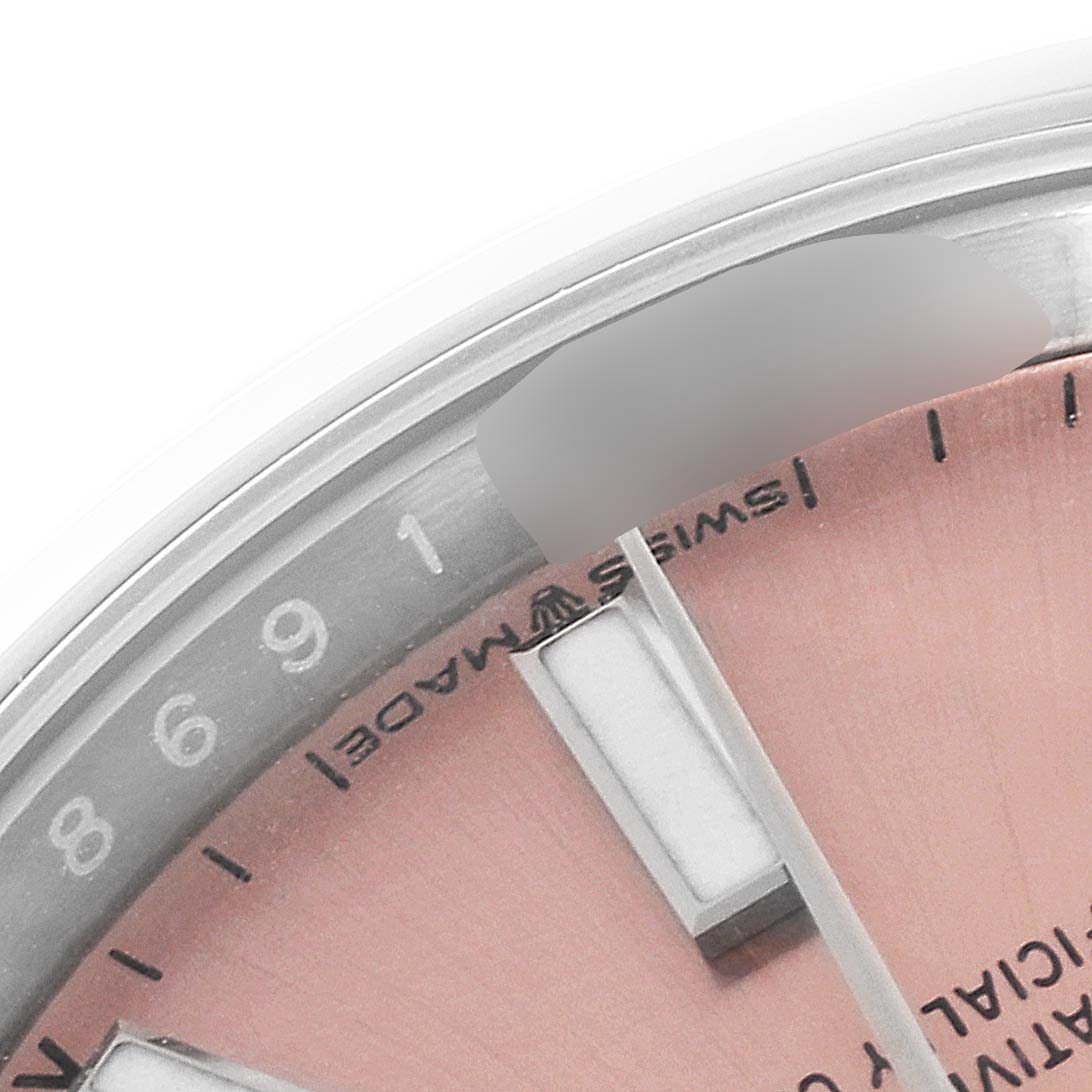 The image shows a close-up of the dial and bezel of a Rolex Oyster Perpetual 124200 Men
s Stainless Steel Pink Dial 124200 Men
s Stainless Steel Pink Dial watch.