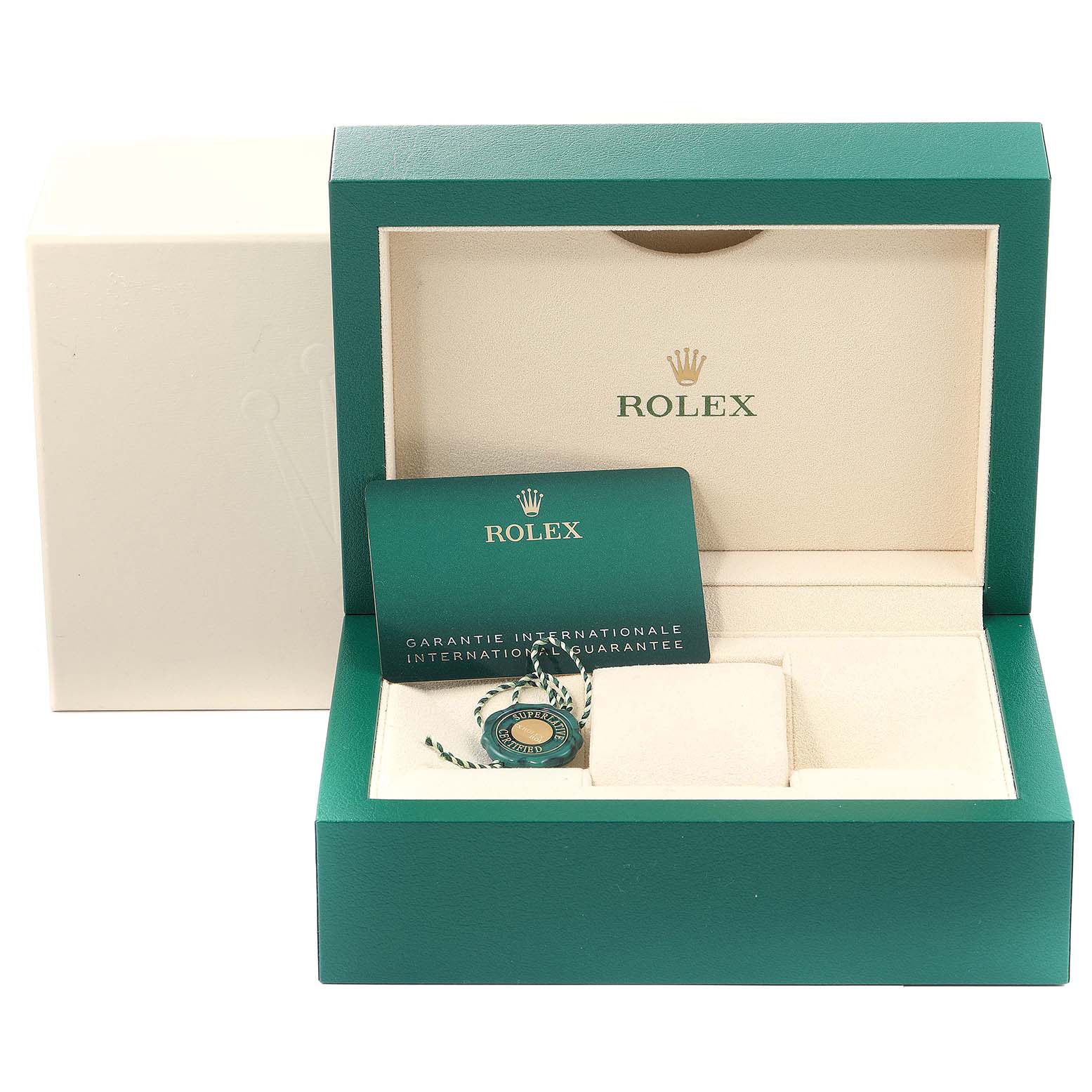 This image shows the open box of a Rolex Oyster Perpetual 124200 Men
s Stainless Steel Pink Dial 124200 Men
s Stainless Steel Pink Dial, featuring the international guarantee card and a green tag inside.