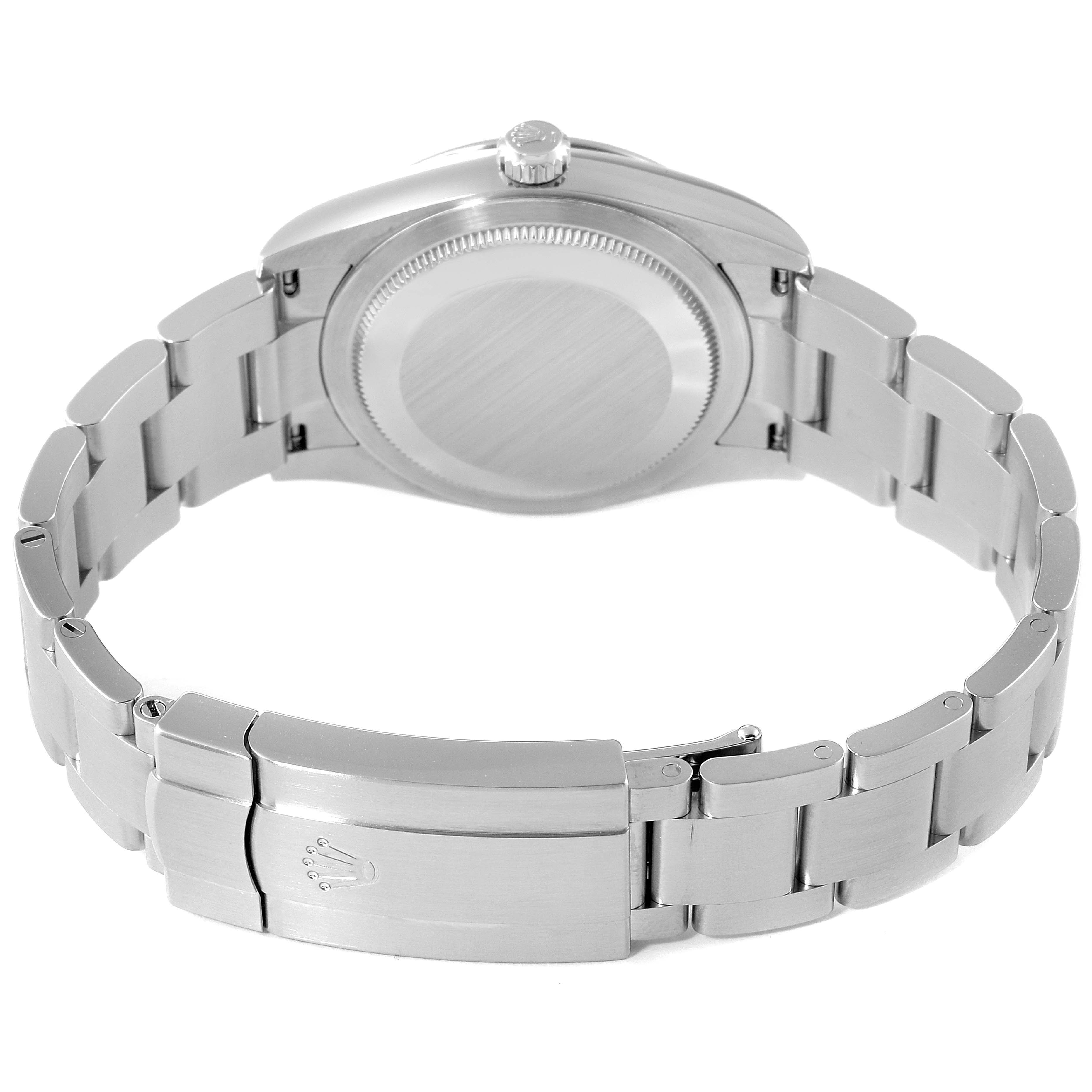 This is a rear view of a Rolex Oyster Perpetual 124200 Men
s Stainless Steel Pink Dial 124200 Men
s Stainless Steel Pink Dial watch showing the case back, crown, and bracelet with a clasp displaying the Rolex logo.