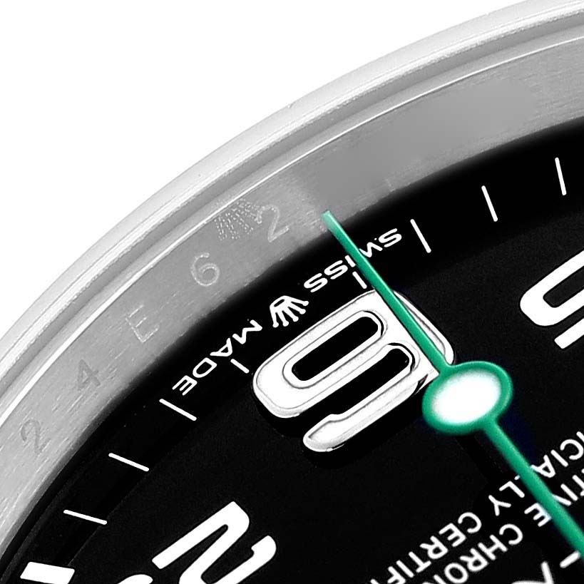 The image shows a close-up of the dial and bezel of a Rolex Air-King 126900 Men's Stainless Steel Black Dial 126900 Men's Stainless Steel Black Dial, highlighting numerals and the seconds hand.
