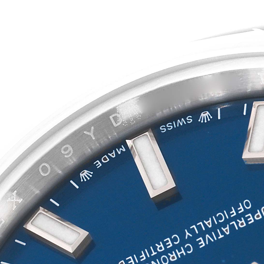 This image shows a close-up of the dial and part of the bezel of a Rolex Oyster Perpetual 276200 Women's Stainless Steel Blue Dial 276200 Women's Stainless Steel Blue Dial watch.