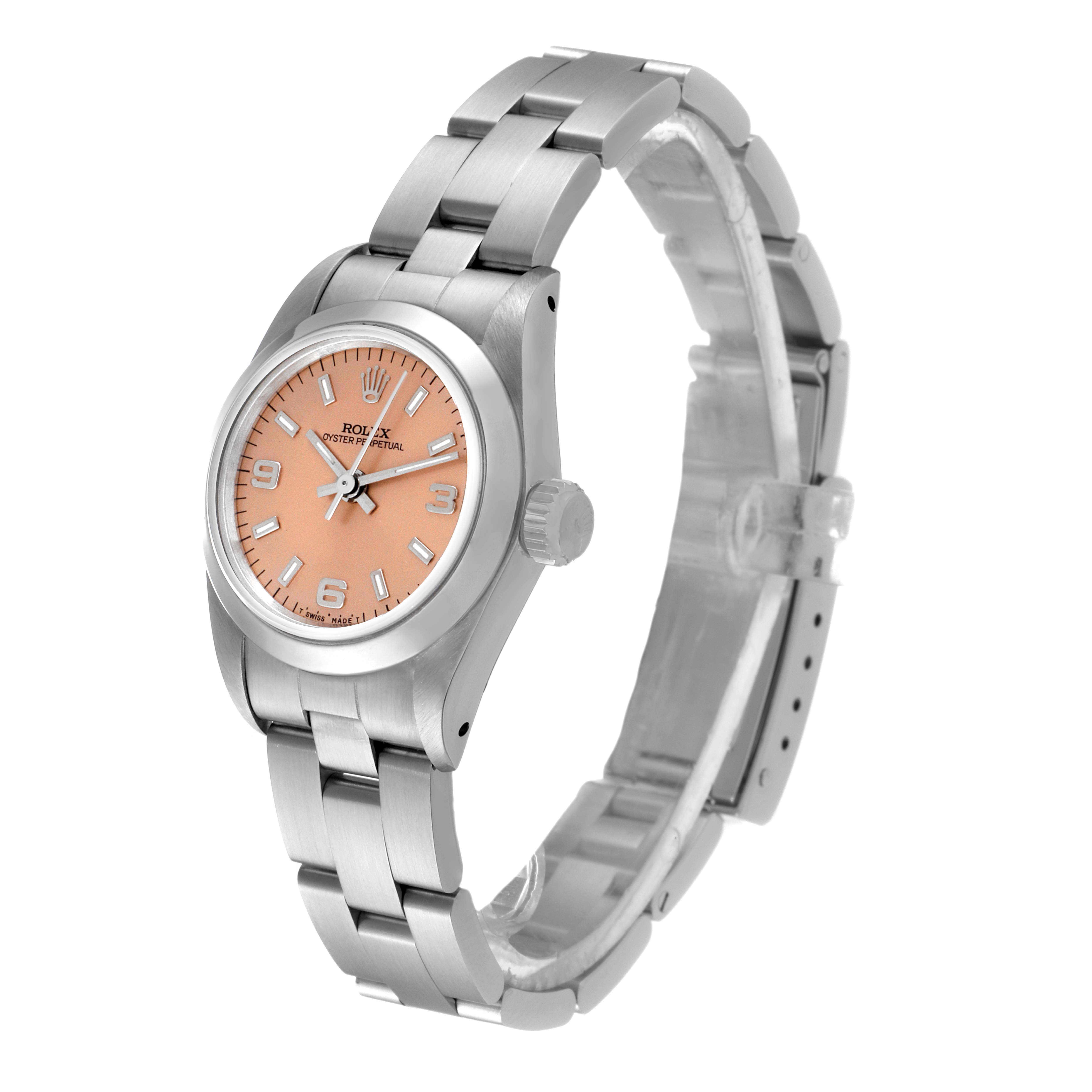 This Rolex Oyster Perpetual 67180 Women's Stainless Steel Pink Dial 67180 Women's Stainless Steel Pink Dial watch is shown at a slight angle, displaying its face, band, bezel, and crown.