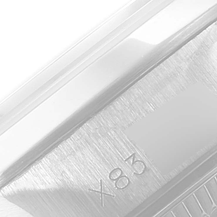 The image shows a close-up of the side of the band or case of the Rolex Oyster Perpetual 67180 Women's Stainless Steel Pink Dial 67180 Women's Stainless Steel Pink Dial watch.