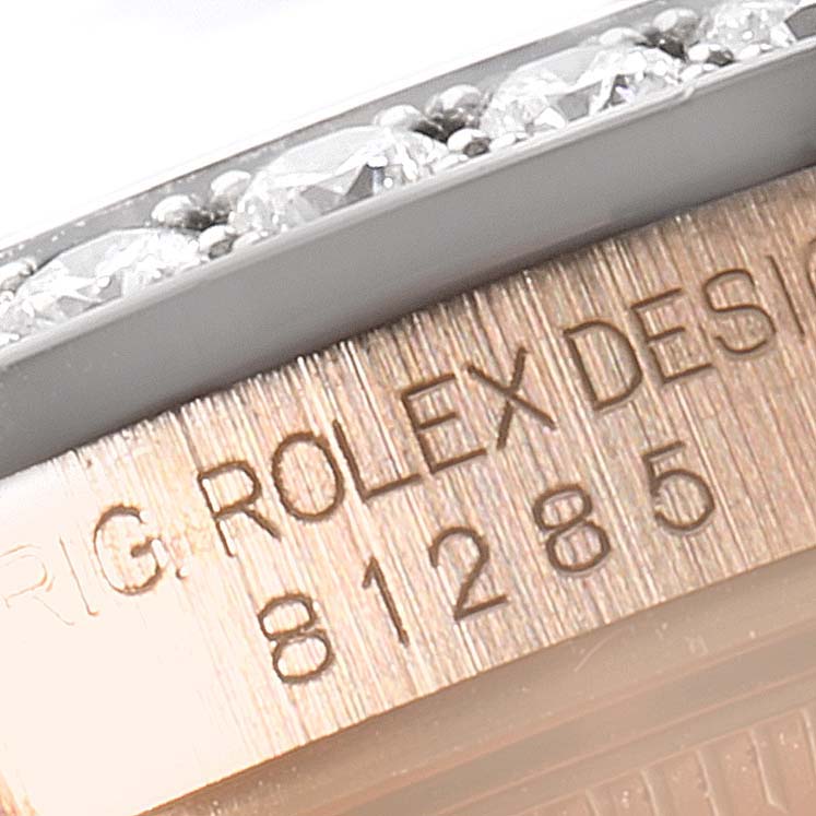 This image shows a close-up of the bezel and part of the inner engraving of a Rolex Pearlmaster 81285 Women's Rose Gold Pink Dial 81285 Women's Rose Gold Pink Dial watch.