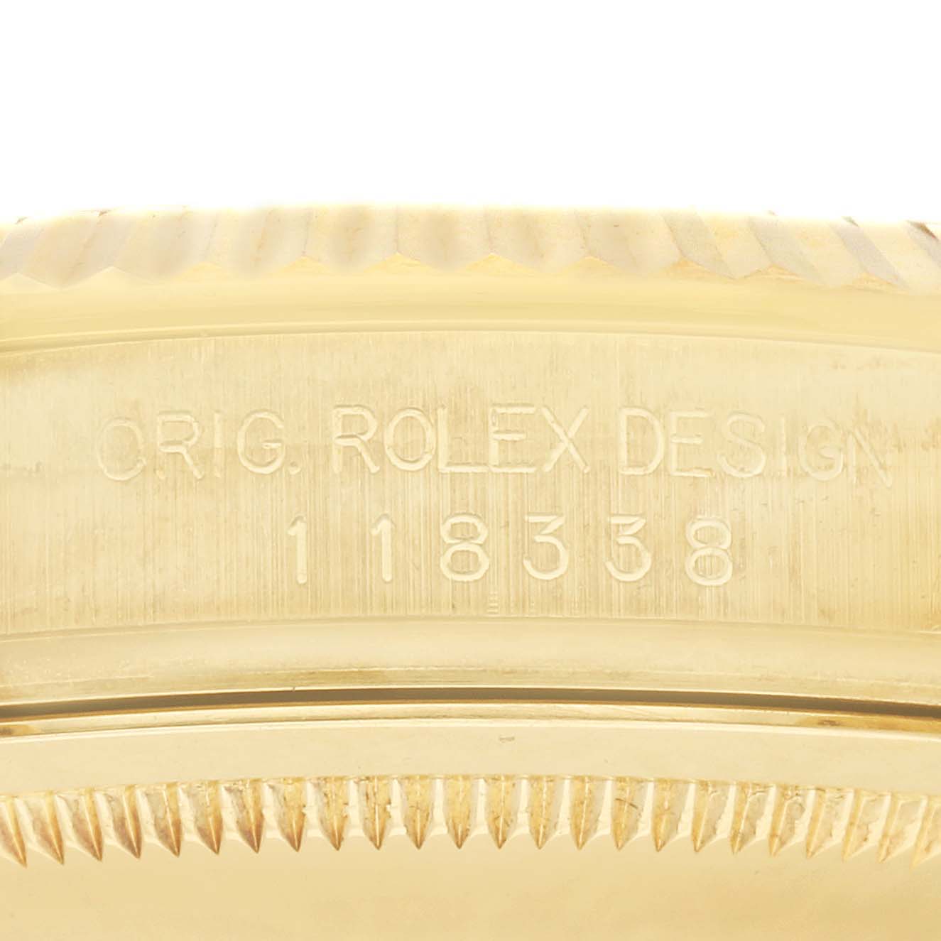 The image shows a close-up of the case side with engraving "ORIG. ROLEX DESIGN 118338" on the Rolex President 118338 Men
s Yellow Gold Silver Dial 118338 Men
s Yellow Gold Silver Dial model.