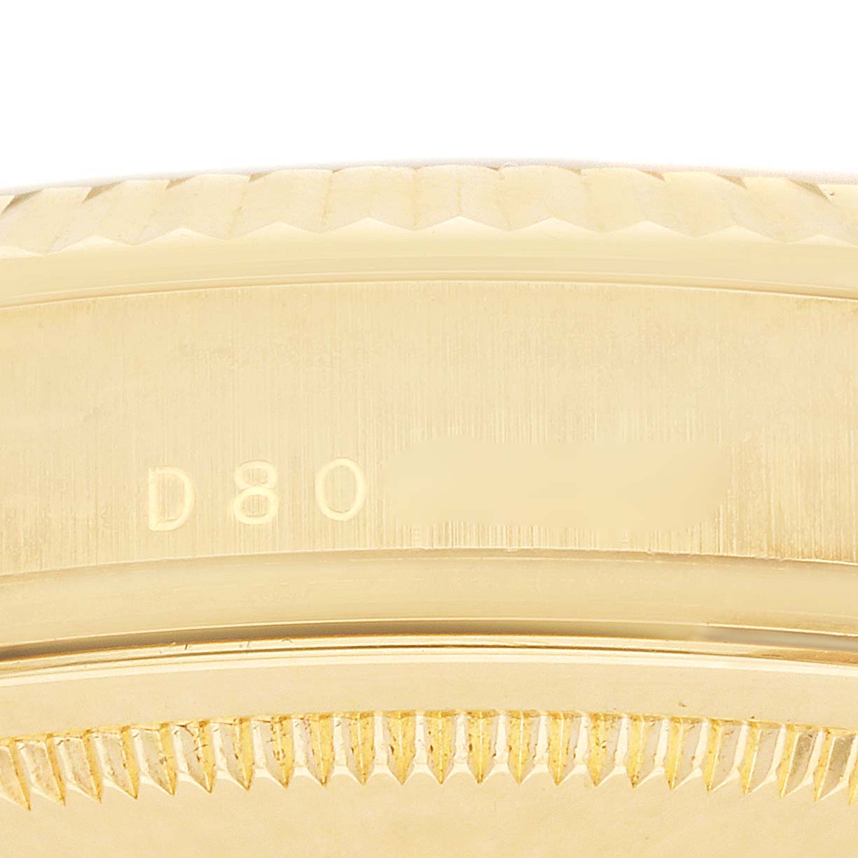 The image shows a close-up side view of the Rolex President 118338 Men
s Yellow Gold Silver Dial 118338 Men
s Yellow Gold Silver Dial model, focusing on the case edge and bezel with engraved numbers.