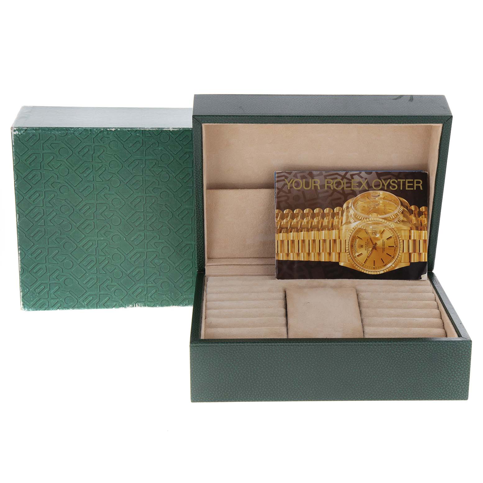 This image shows an open green Rolex box for the President model, along with its booklet.